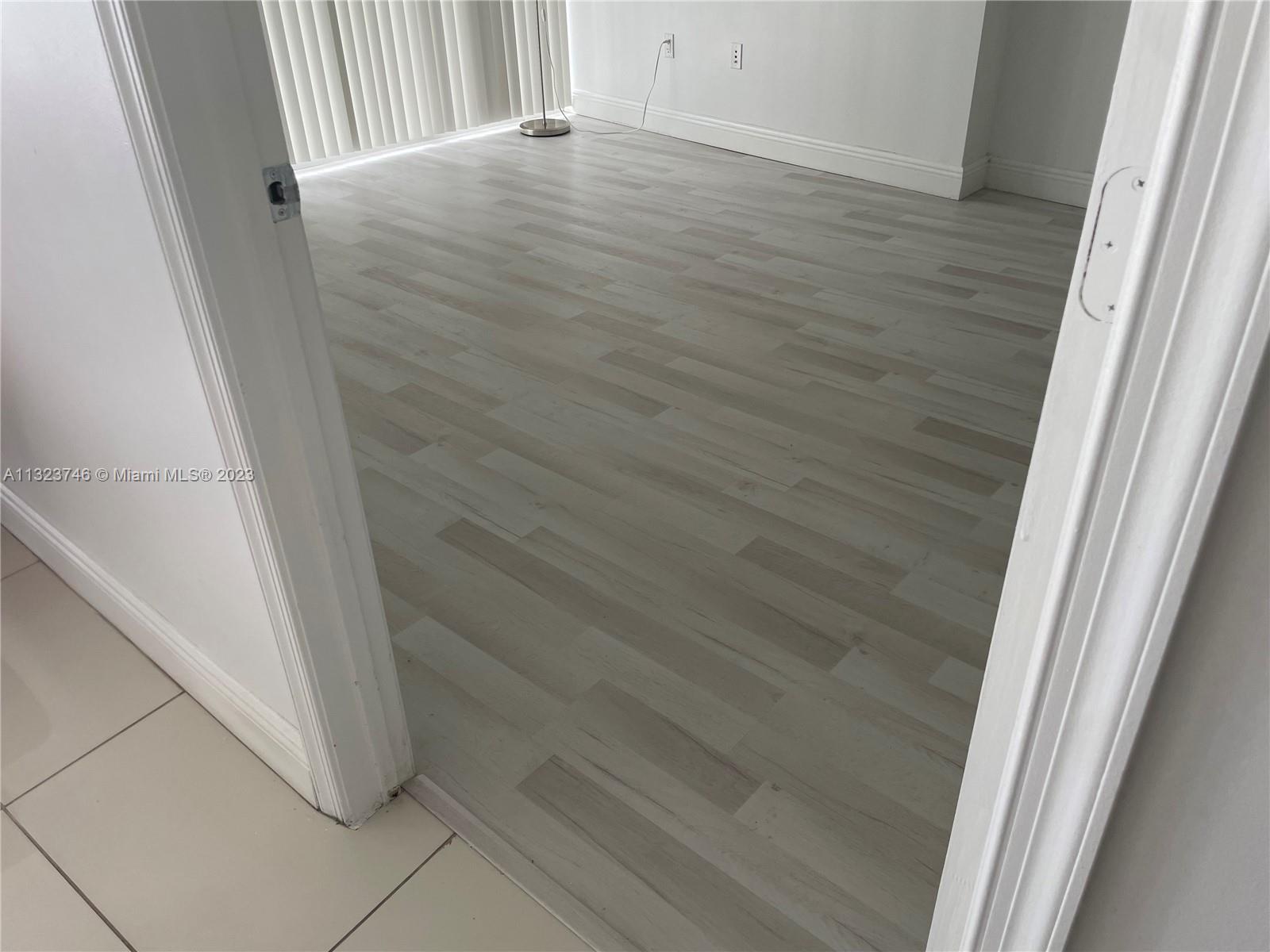 BEDROOM WITH LIGHT FLOOR