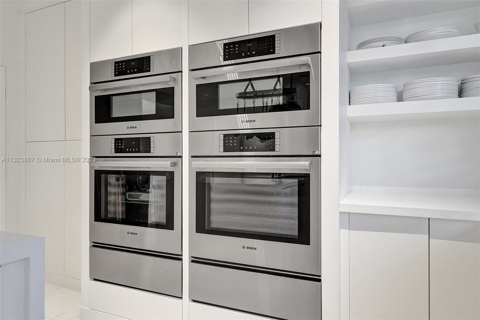 top of the line dual Bosch Wi-Fi controlled  oven, speed microwaves with convection and warming drawers