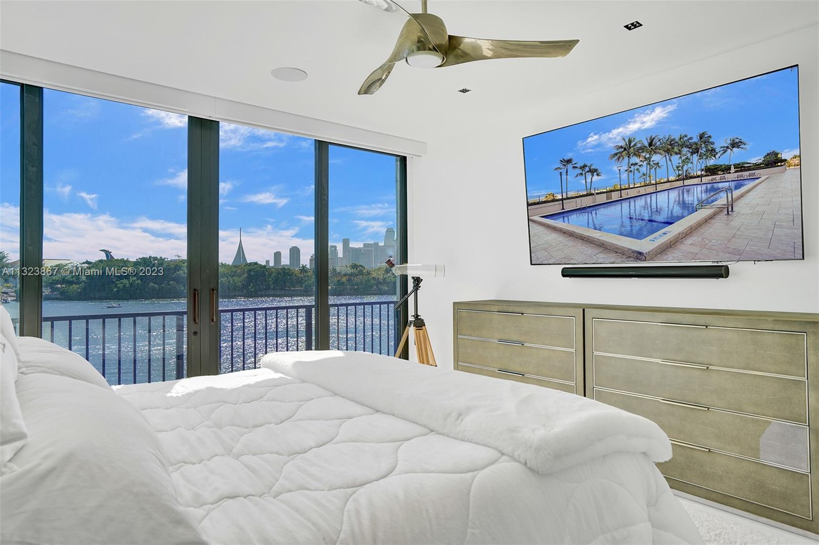 primary bedroom with downtown miami skyline views