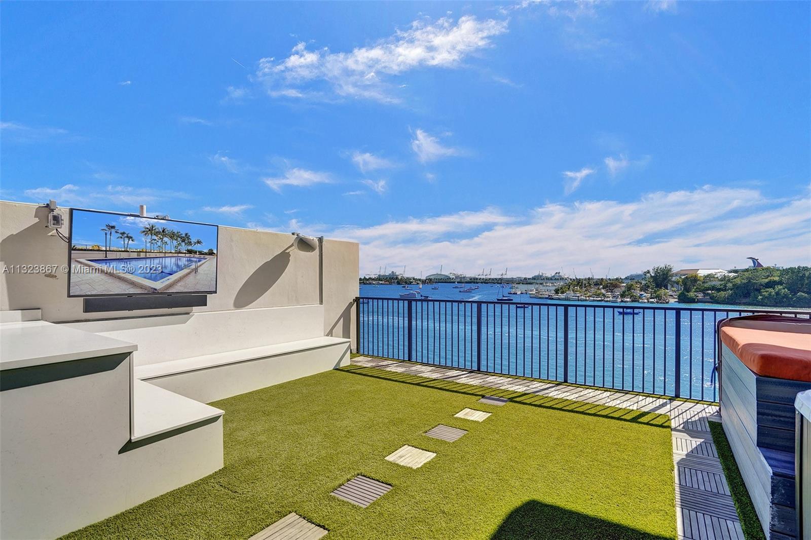 4th floor rooftop: top of the line astroturf with teal accents, and storage and seating areas, daybed configurations, 65 inch Samsung extra bright outdoor TV with outdoor speakers for TV, 8 outdoor speakers connected to home automation, and 7000 gallon jacuzzi for 7 people.