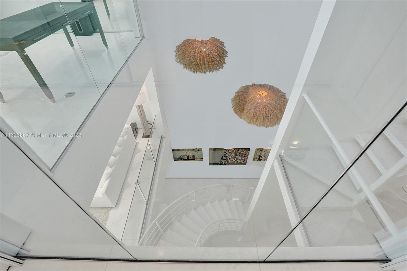 35ft high foyer with natural light from ground floor entrance to roof. 3ft square White carrera marble. museum reveal walls