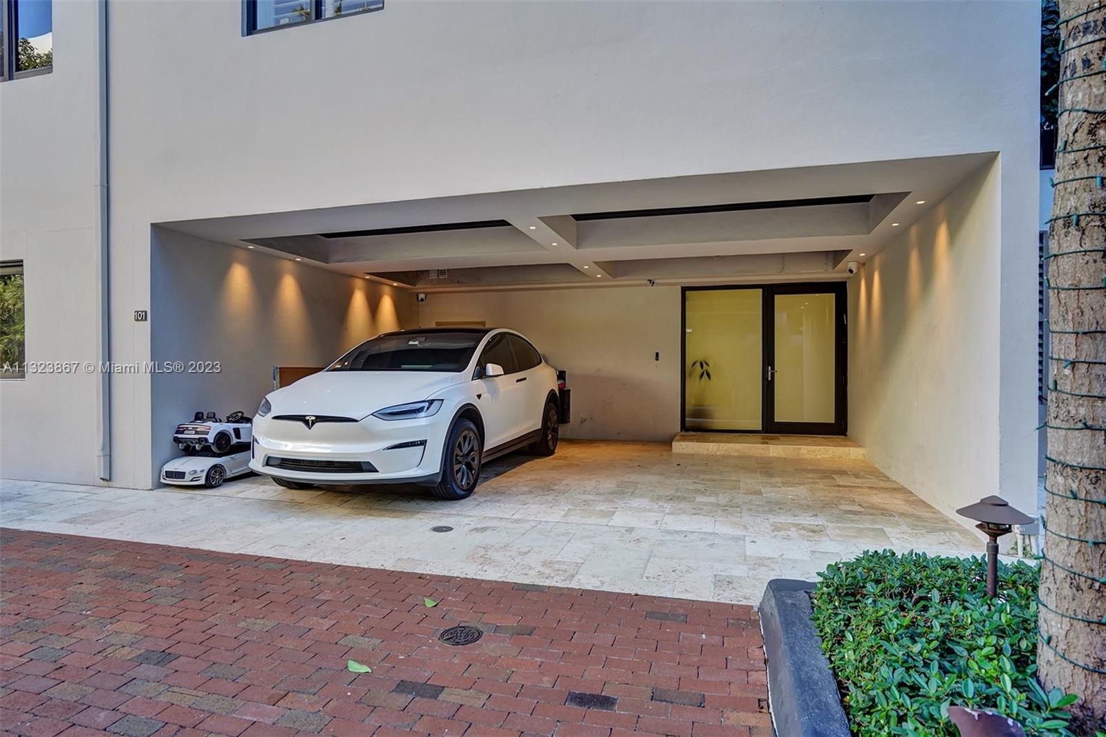 2 covered spaces at private entrance to home with 1 further covered space in garage.