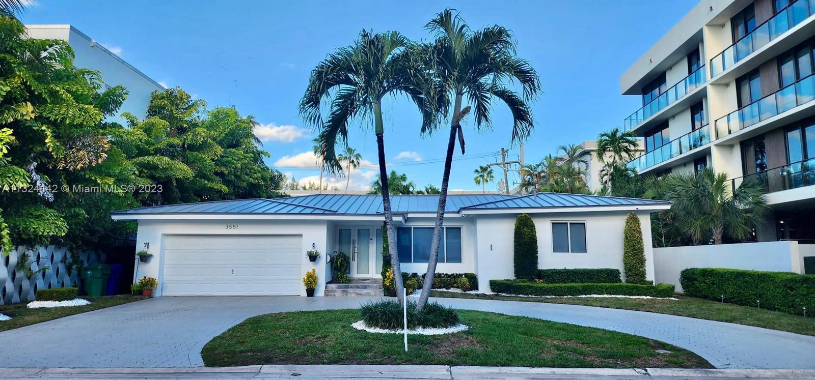 OPEN HOUSE THIS SUNDAY, MARCH 19TH. 11:00 AM - 2:00 PM. This spectacular one story house is In the heart of North Coconut Grove, in a exclusive cul-de-sac neighborhood. Square footage larger than tax roll (2,650 sq. ft.) A 5-bedroom and 3-modern bathroom home plus an office with beautiful Italian porcelain wood look floor. An airy open floor plan includes a dining, living, and family room and a large kitchen with plenty of quartz counter space, cabinets, and stainless-steel appliances. Just beyond the family room, a lovely, fenced-in backyard, neatly landscaped, with a 20x20 covered wood pergola perfect for outdoor activities. Renovated Saltwater pool and a 2-car garage with plenty of storage. Brand new slate metal roof finished in Dec. 2022 with transferable warranty to new owner.