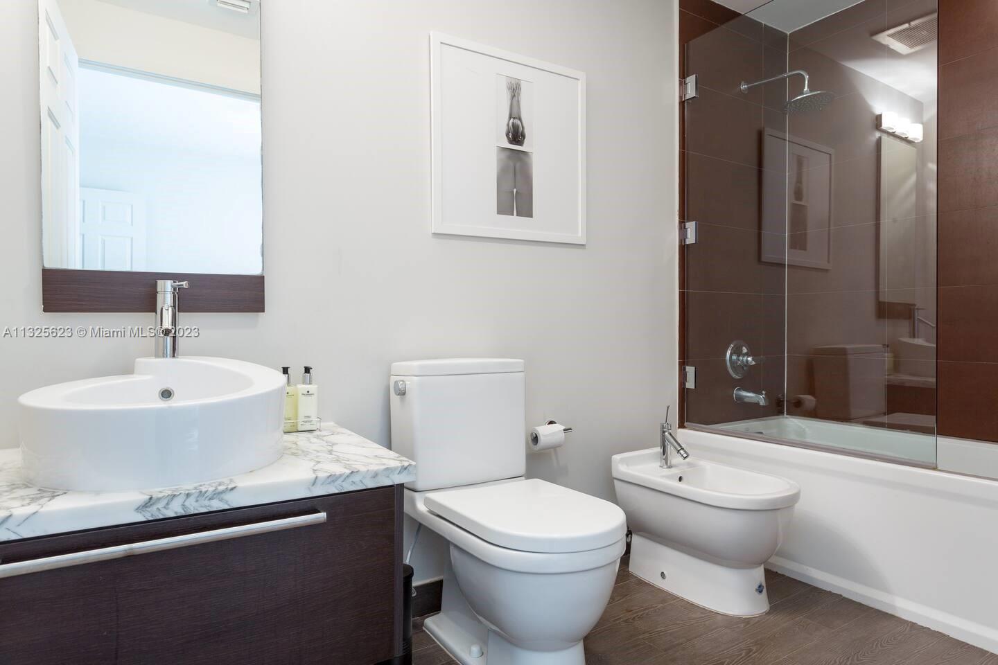 Master bathroom with bathtub