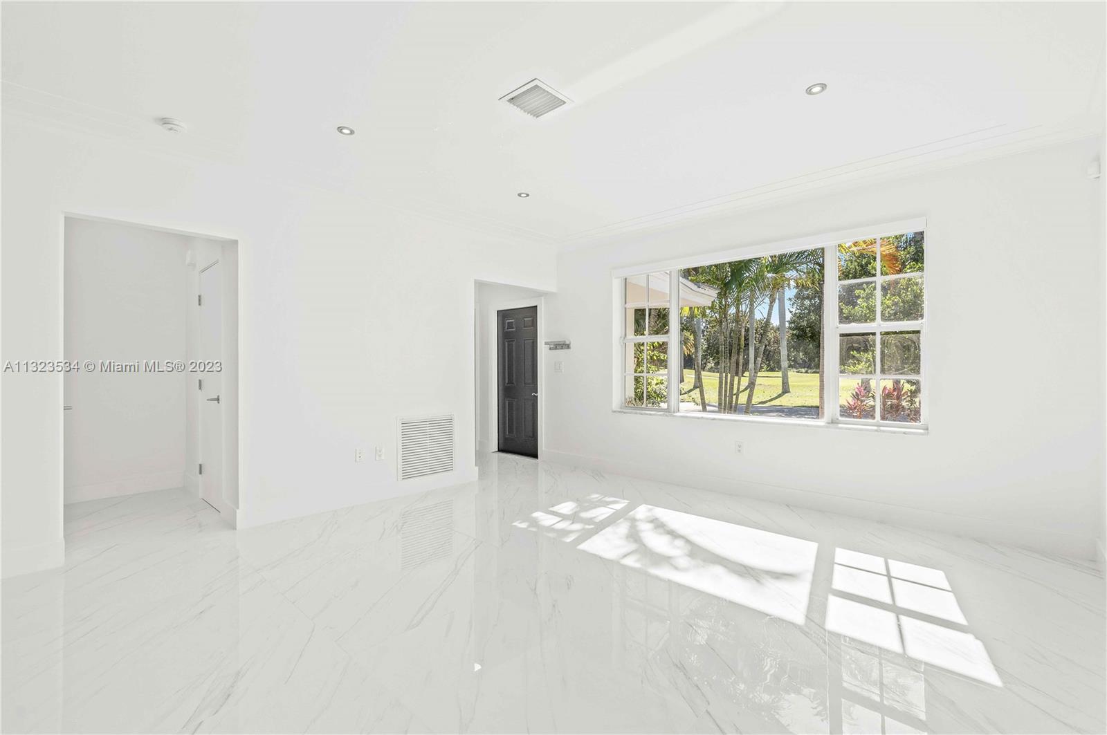 living room, entrance to primary bedroom