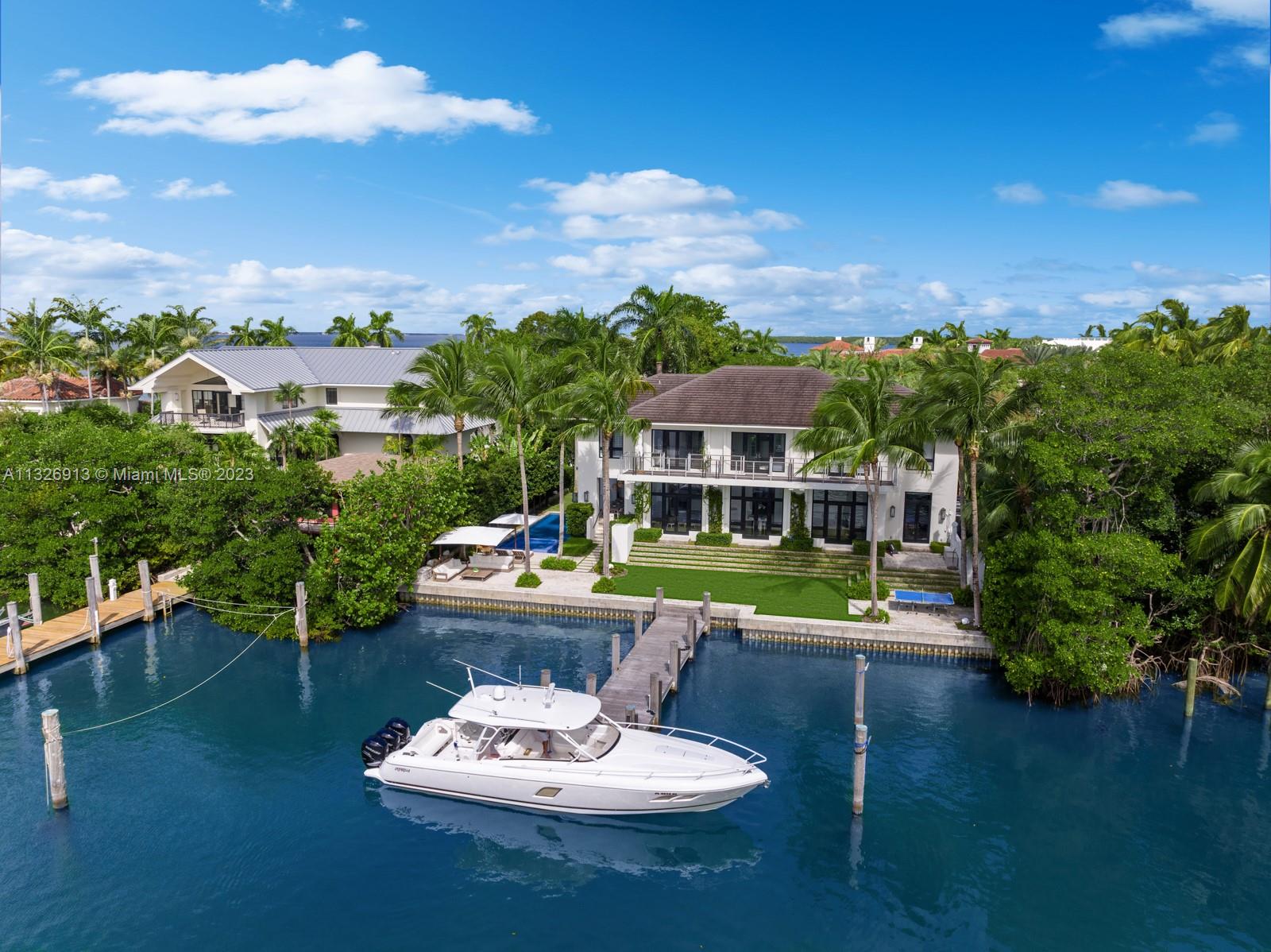 Unique opportunity to purchase an award-winning custom, waterfront home built in 2015 by prestigious architect Jorge Hernandez, with interiors by James Duncan. Located in Smuggler Cove, this ‘smart’ residence boasts expansive water views while being protected from the open ocean elements. A 50’ by 10’ dock will accommodate vessels up to 100 ft. This is one of the finest custom built homes you will ever see! Unparalleled natural light & high ceilings. Custom woodwork, Waterworks hardware, Italian granite, wide plank wooden floors, custom-cut marble in bathrooms, and custom designer lighting. Professionally landscaped exterior, pool w/ Jacuzzi, Loggia w/ outdoor kitchen, Marvin hurricane-grade doors & windows throughout, and full Crestron and Lutron system to complete the home.