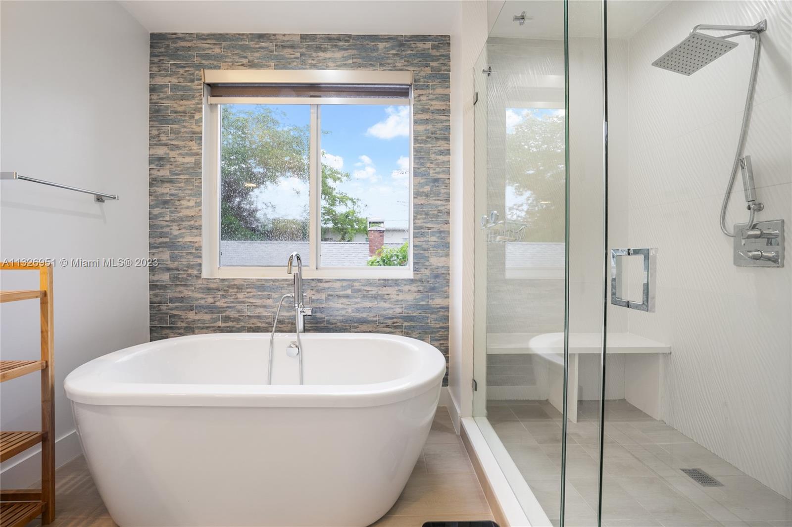 Close-up | Owners Ensuite Bathroom | Roman Tub and Glass Enclosed Shower w/ bench