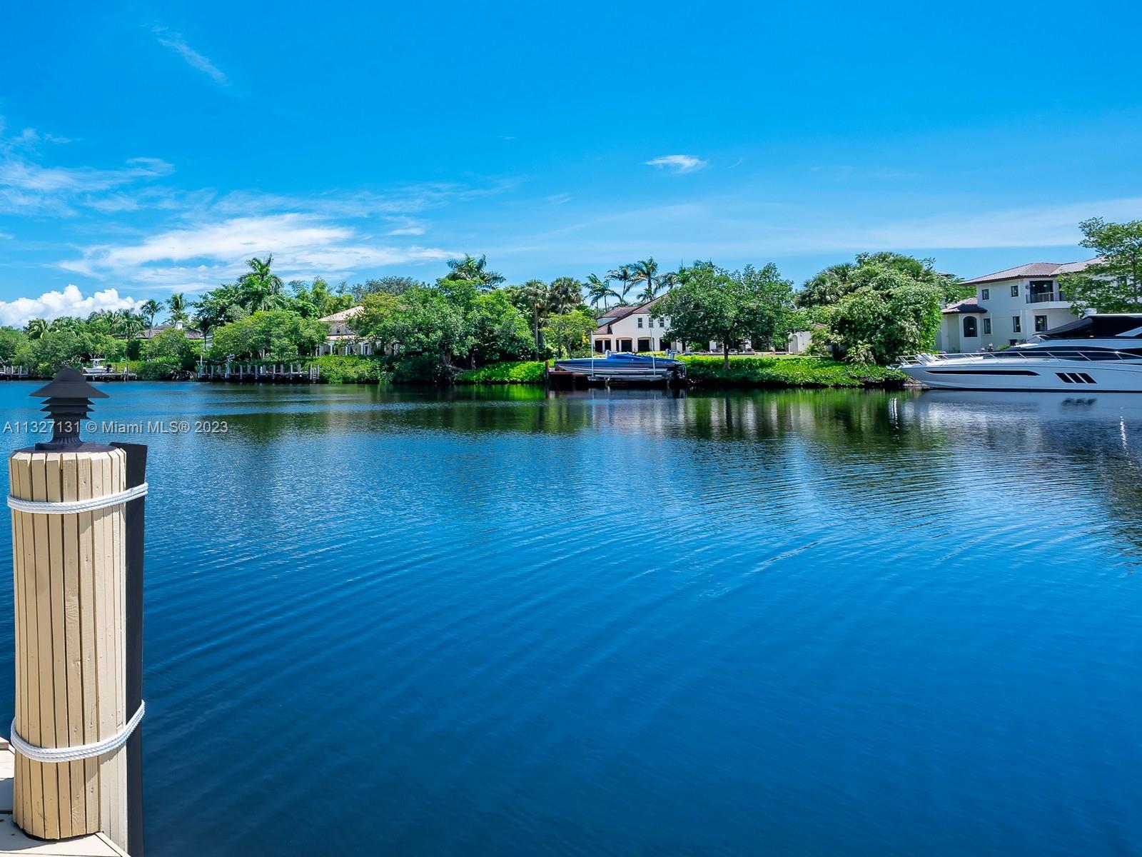 waterfront views from this one story home located in Cocoplum, one of the most desirable gated communities in Coral Gables. This beautiful 6,735 adjusted sqft home, with 6 Bed, 5 1/2 Bath, and a 2 car garage, showcases breathtaking wide canal water views with resort-like gardens visible from almost every room. Living room with fireplace, formal dining room, entertaining area, kitchen, office space, playroom and more. Brick circular driveway with porte cochere accommodates a large family and excellent for entertaining. Meticulously maintained. Largest lot in Cocoplum on the market with approx. 32,000 sqft, dock of 80 ft, and water frontage of 138 ft. Expansive covered terrace, summer kitchen, and large pool with whirlpool.