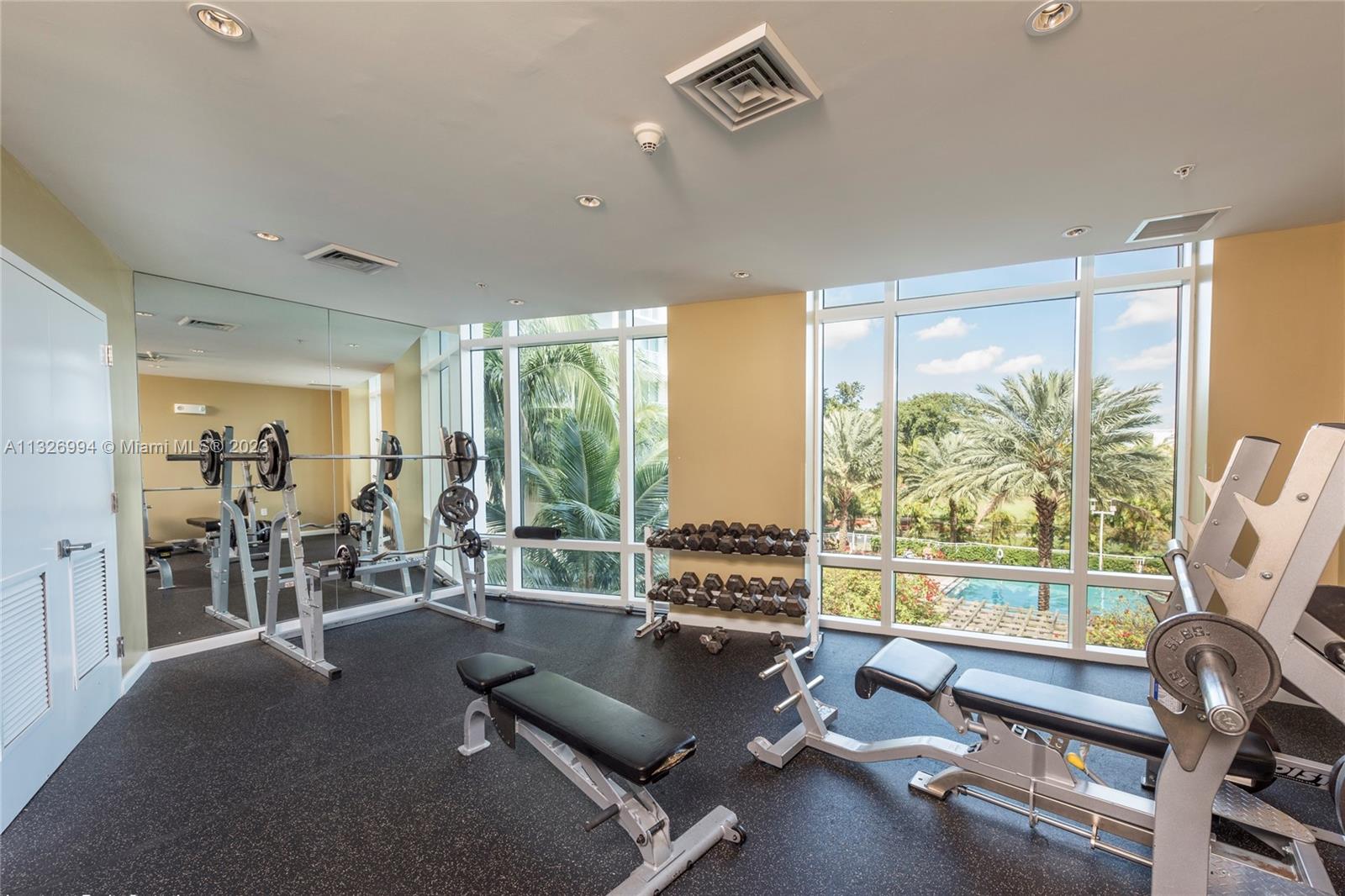 Beautiful fitness area facing the golf course and pool area.