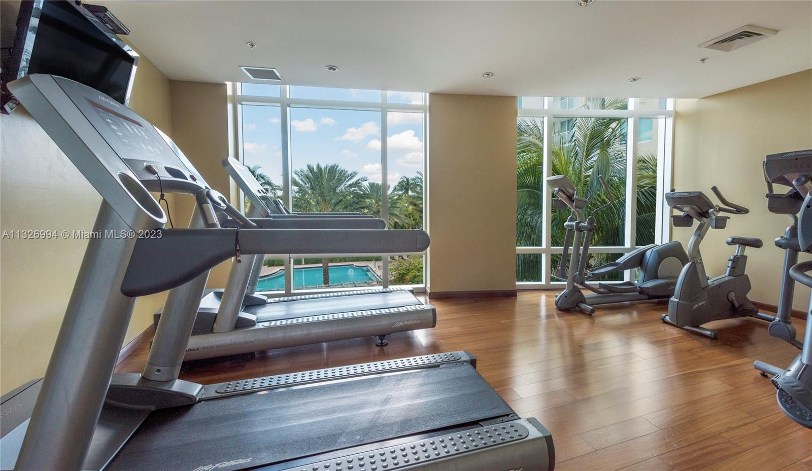 Beautiful fitness area facing the golf course and pool area.