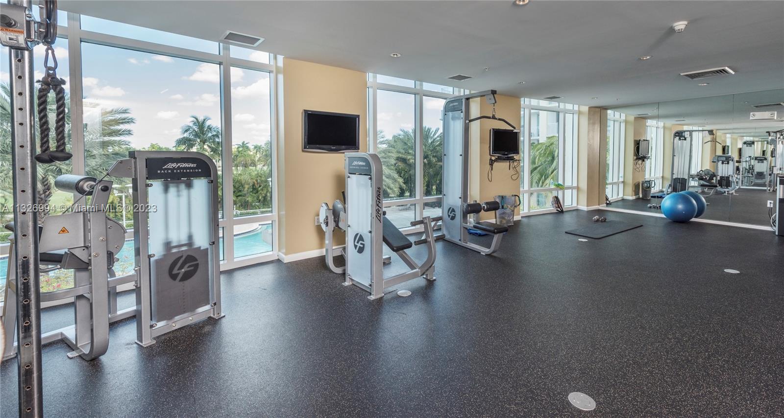 Beautiful fitness area facing the golf course and pool area.