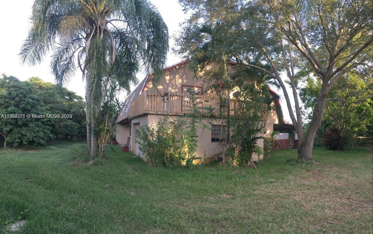 NESTLED AMOUNG AN ORCHARD OF LYCHEE TREES EXISTS AN EXCEPTIONAL MULTI-FAMILY OPPORTUNITY IN THE REDLAND! THIS PRIVATE COUNTRY ESTATE FEATURES A 5 BED 3.5 BATH MAIN HOUSE WITH A ONE CAR GARAGE AND A SEPARATE LARGE 1/1 GUEST HOUSE. MAIN HOUSE OFFERS UPDATED KITCHEN, TWO LIVING ROOMS, AND TWO MASTER BEDROOMS. THERE IS A MAGNIFICENT BALCONY AMOUNGST THE TREE TOPS AND LOVELY BACK PORCH THAT IS PERFECT FOR ENTERTAINING. THE 1/1 GUEST HOUSE IS LARGE AND COMFORTABLE. THE DETACHED 3 CAR GARAGE IS SPACIOUS AND PRACTICAL. NEAR NATIONAL PARKS AND THE FLORIDA KEYS IT IS AN ISLAND OF PARADISE ON NEARLY 2 ACRES! DO NOT DISTURB TENANTS. LARGE DOGS ON-SITE. SHOWINGS LIMITED TO PRE-QUALIFIED BUYERS WITH PROOF OF FUNDS. NO HOA. NO CDD. OWNER FINANCING OPTION MAY BE EXTENDED WITH SUBSTANTIAL DOWN-PAYMENT.