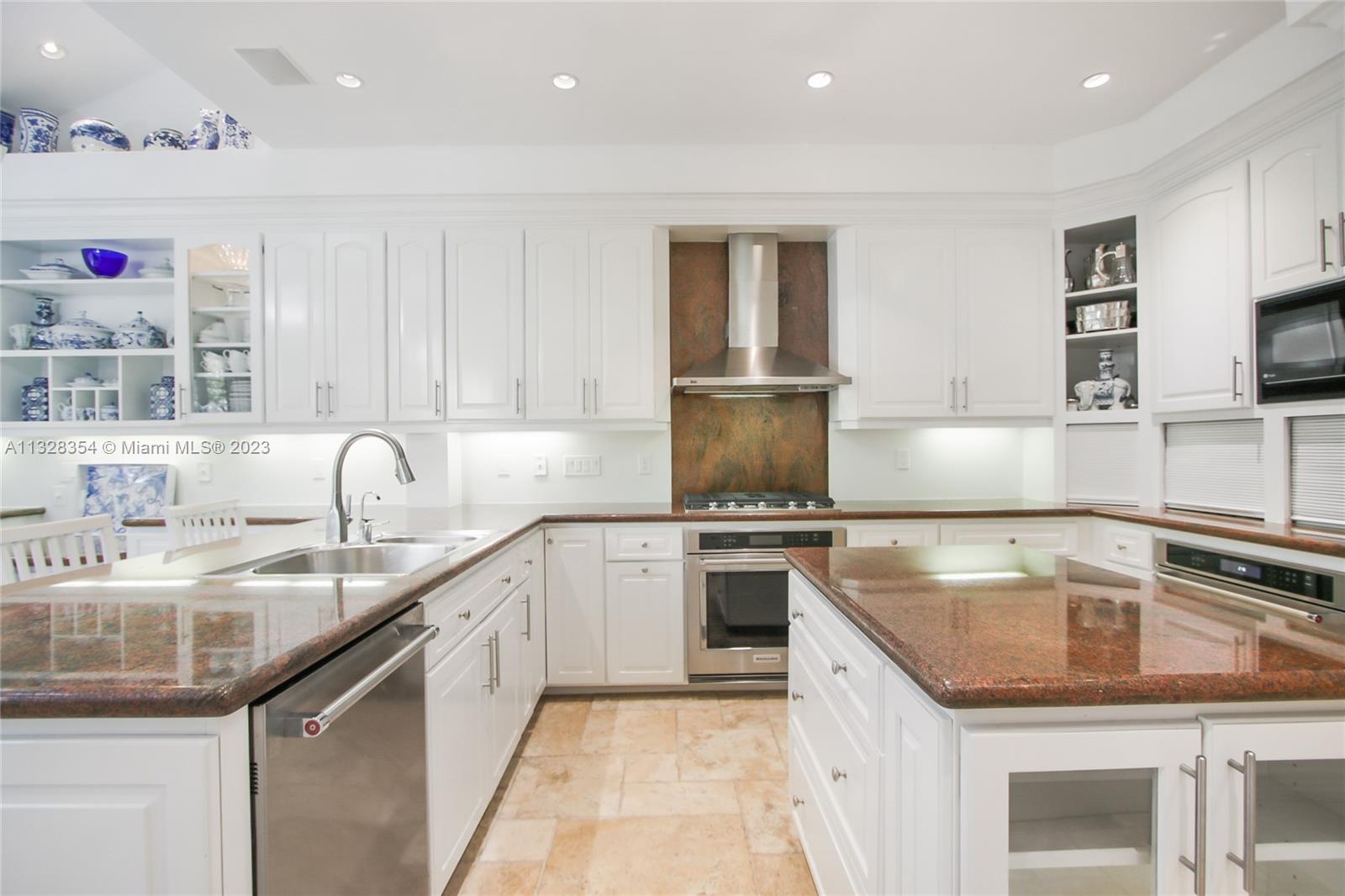 Spacious and well-appointed kitchen with lots of natural light from windows and skyiights