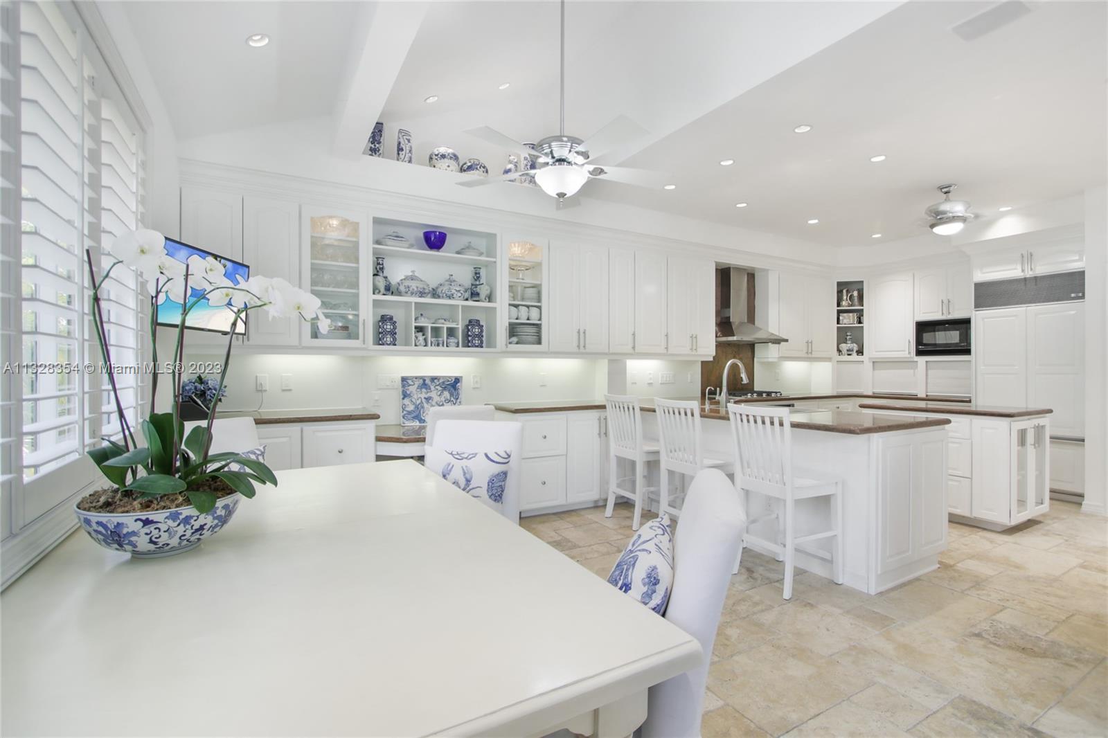 You will enjoy CASA SERENA's large, bright center-island kitchen, Sub-Zero and new KitchenAid gas stove and ovens, its walk-in pantry, custom wooden cabinetry, and plenty of room to cook and entertain at the same time. The heart of the home!
