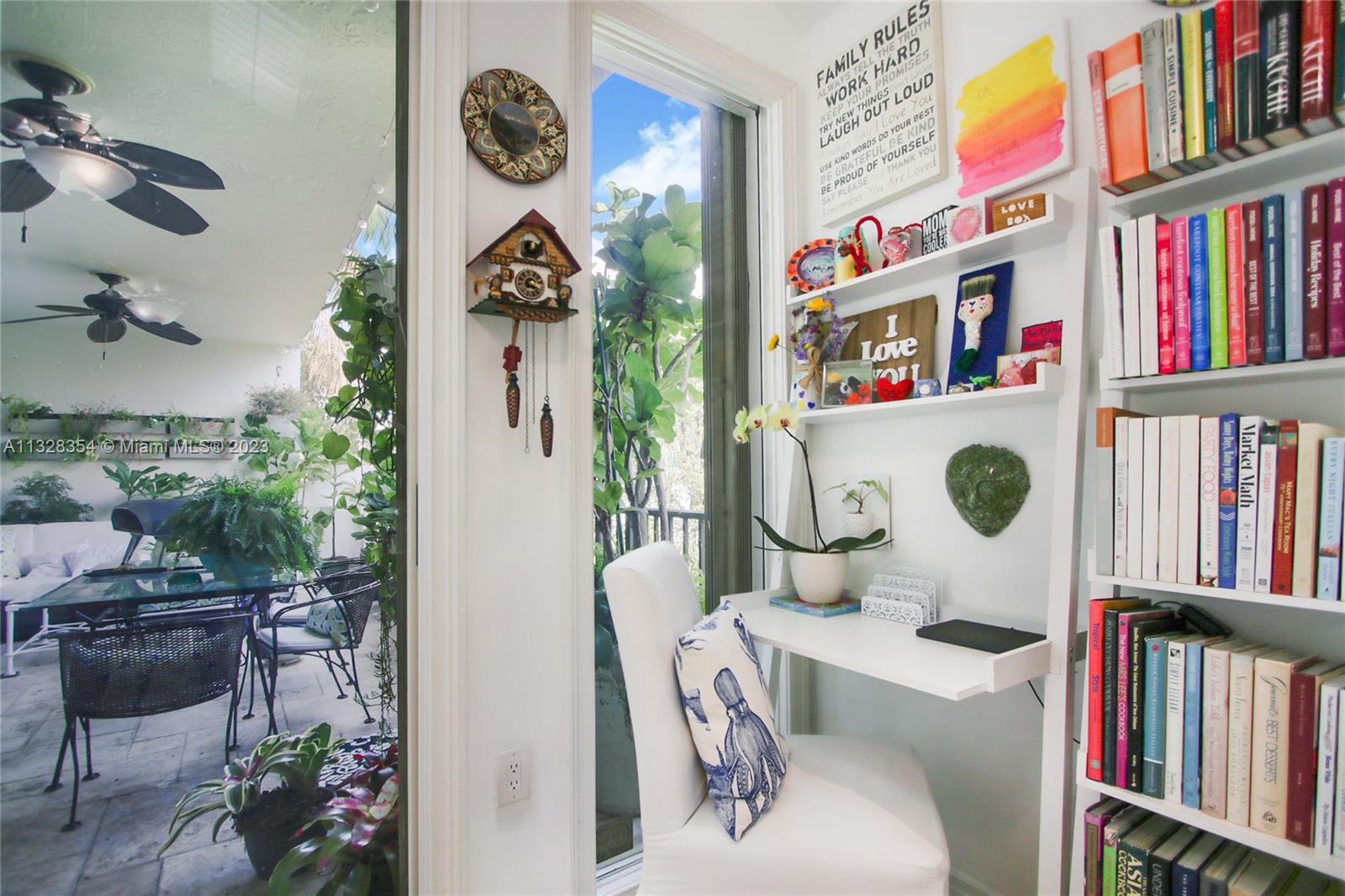 The kitchen is connected to the covered terrace. Room for two great study or work desks