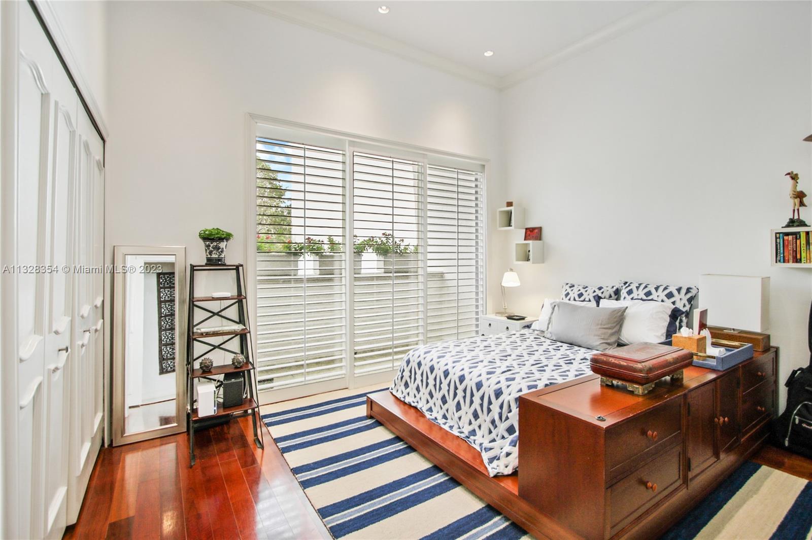 3rd. Bedroom on 2nd. Floor, with high ceilings and its own balcony overlooking the lush landscape