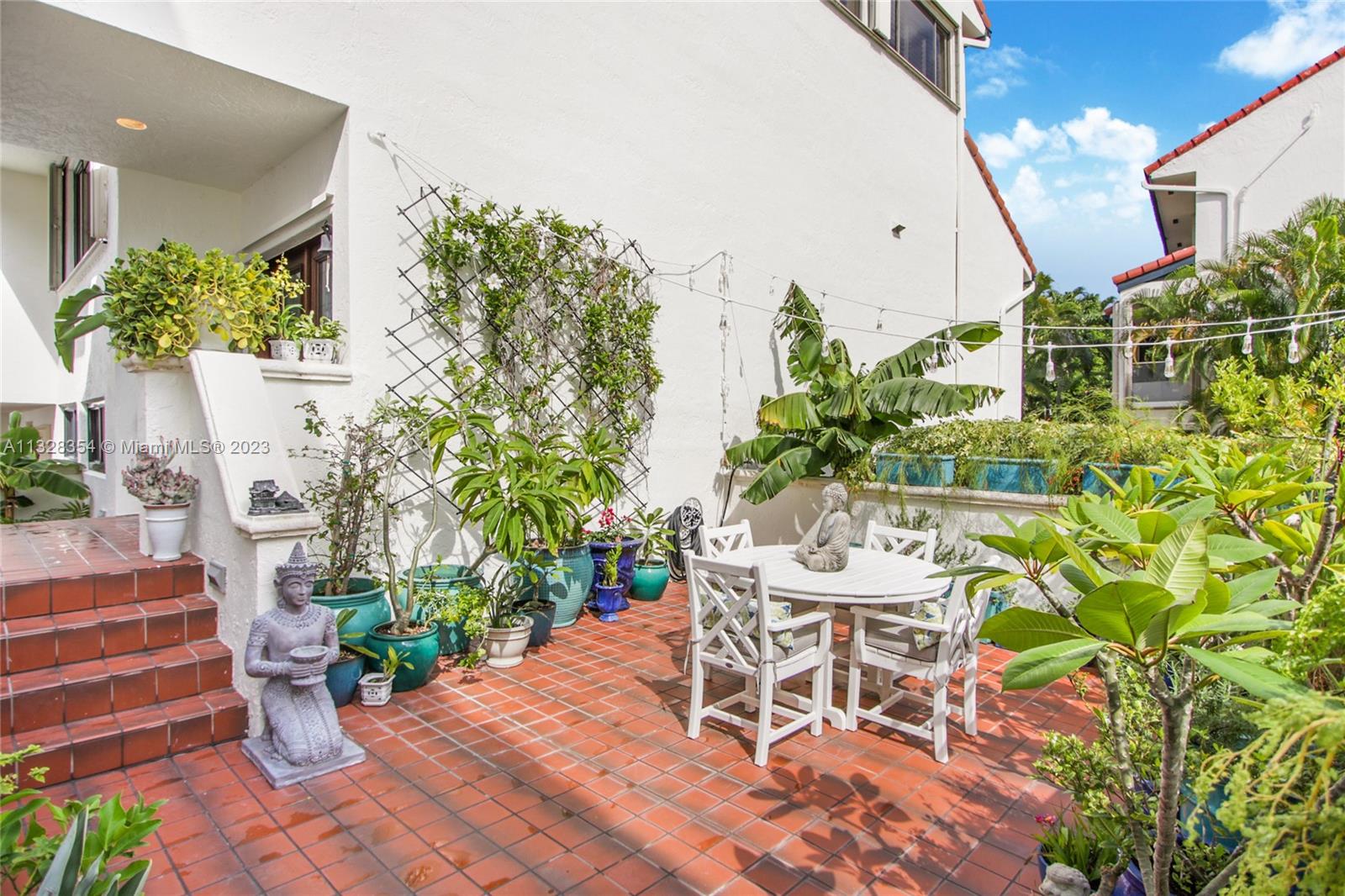 Beautiful garden patio with ample room for outdoor seating. You will enjoy the sound of the running water from surrounding ponds