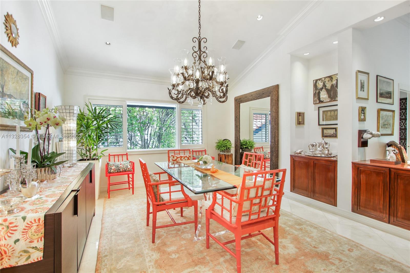 CASA SERENA dining room with volume ceilings, custom built-in cabinetry, great lighting.