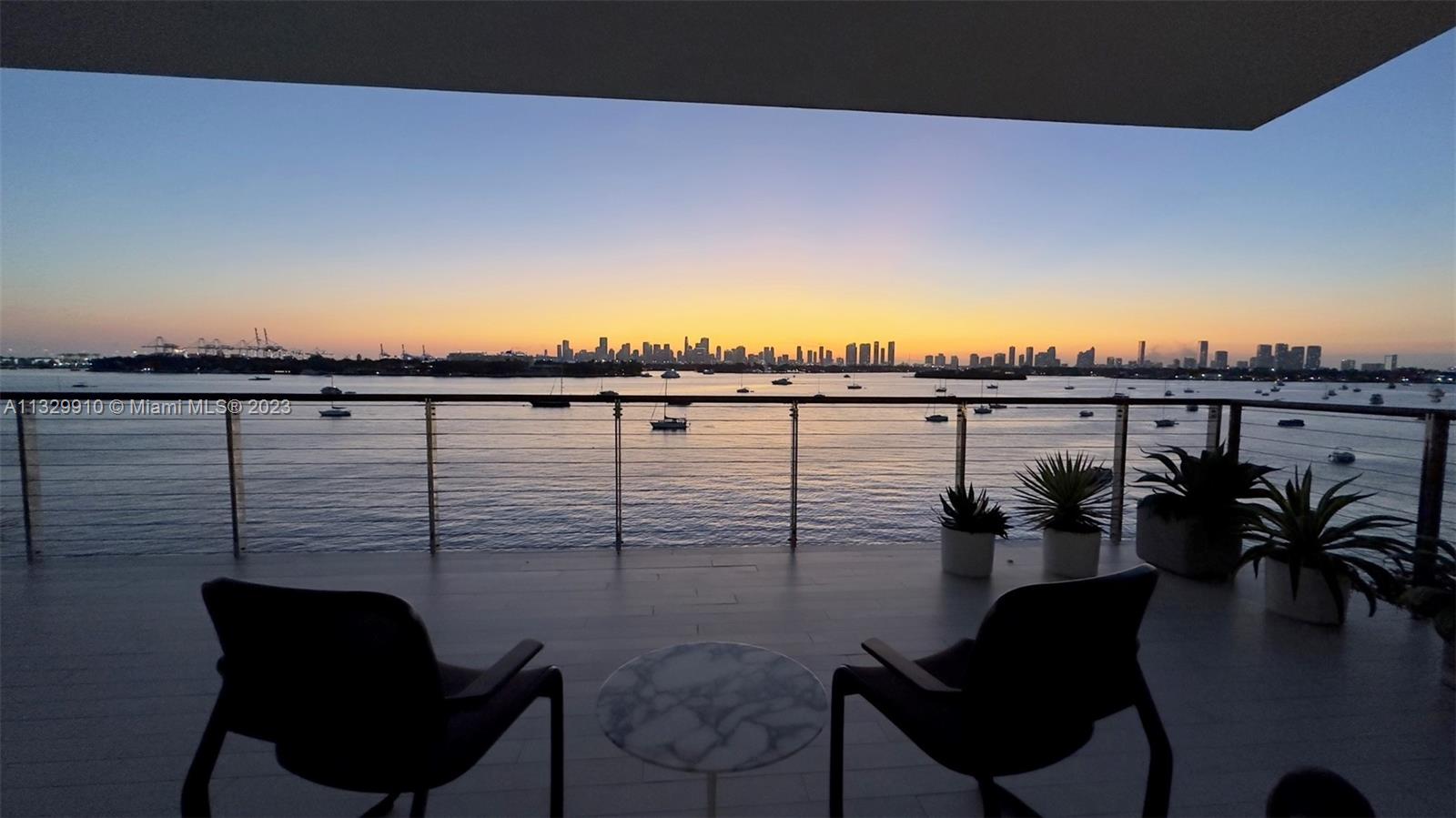 Sitting on top of the bay, gazing at the ever-changing light show produced by Miami Beach’s perfect weather, poised against the spectacular backdrop of the downtown Miami skyline, floating over Biscayne Bay & it’s parade of ships!  You can enjoy the endless entertainment this residence offers from its wrap around covered terrace surrounded by disappearing walls of glass, offering an indoor-outdoor lifestyle. This unit sparkles day & night accomplishing Pritzker Prize winning architect Jean Nouvel’s vision of “reflections” utilizing the city’s natural resources of light, water & surrounding island environments to fulfill a sensory filled ever changing experience from day to night. 2 parking spaces & electric car charging station. This architectural masterpiece is simply magnificent!