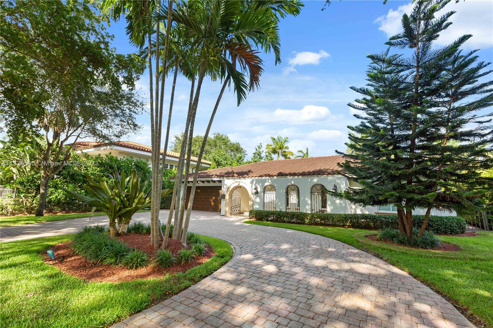 Beautiful and Classic Coral Gables home on one of the most beautiful Oak lined streets in the neighborhood. This impeccable home offers a split plan a kitchen that is open to the Family room, wood, and marble floors as well as a large, elegant living room. It has an indoor laundry room, two car garage and lovely foyer and gate. It has impact windows and doors, as well as a beautiful pool and patio for entertaining. This is a forever home in an amazing location and it’s priced to sell.