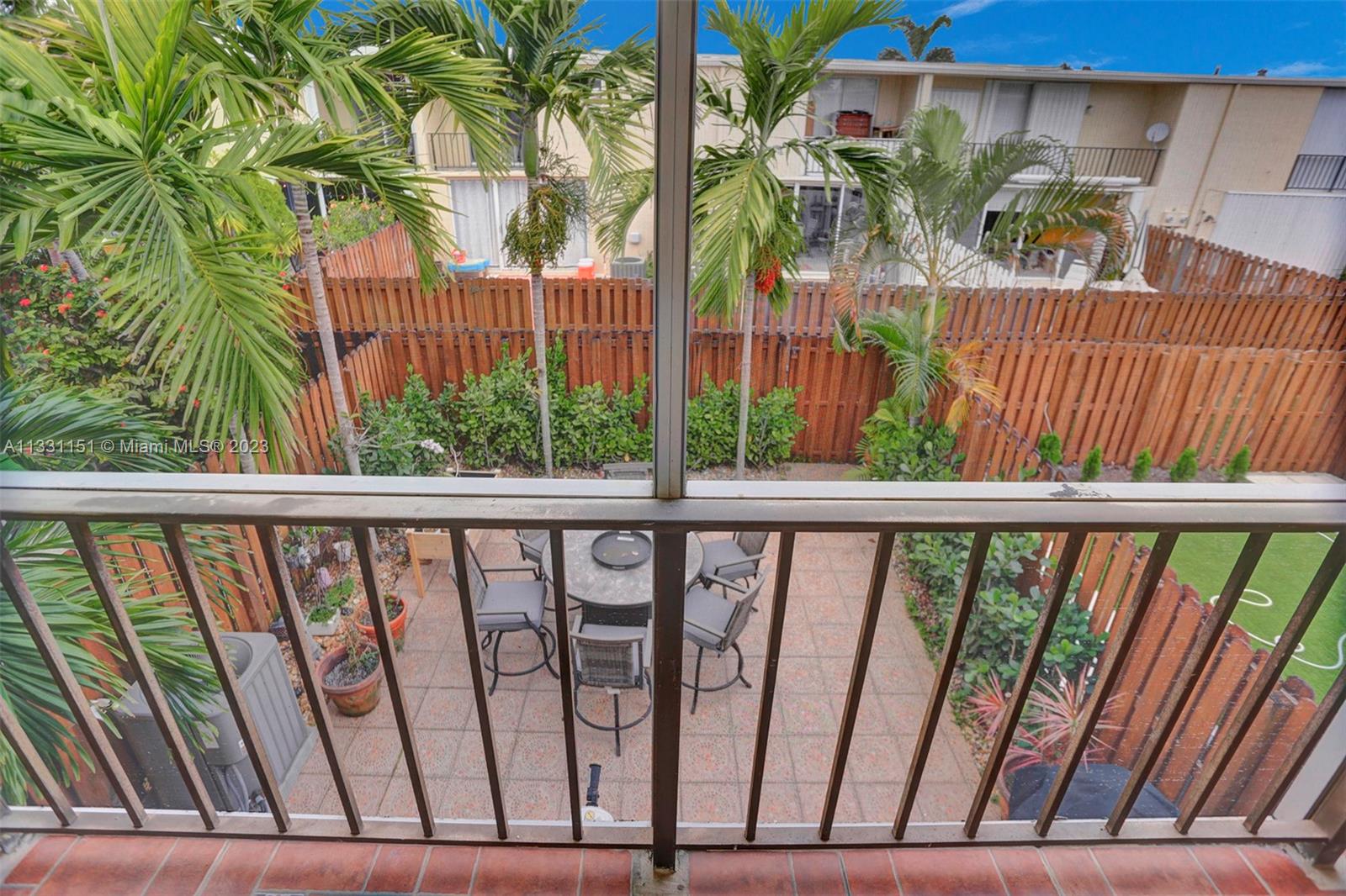 Balcony access from Primary Bedroom with garden view