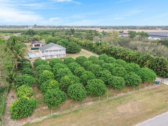 DIAMOND IN THE ROUGH!!! Huge 2 story property in over 4,000 sq ft with a beautiful wraparound balcony, sitting on over 2 acres of land. WON'T LAST!!!