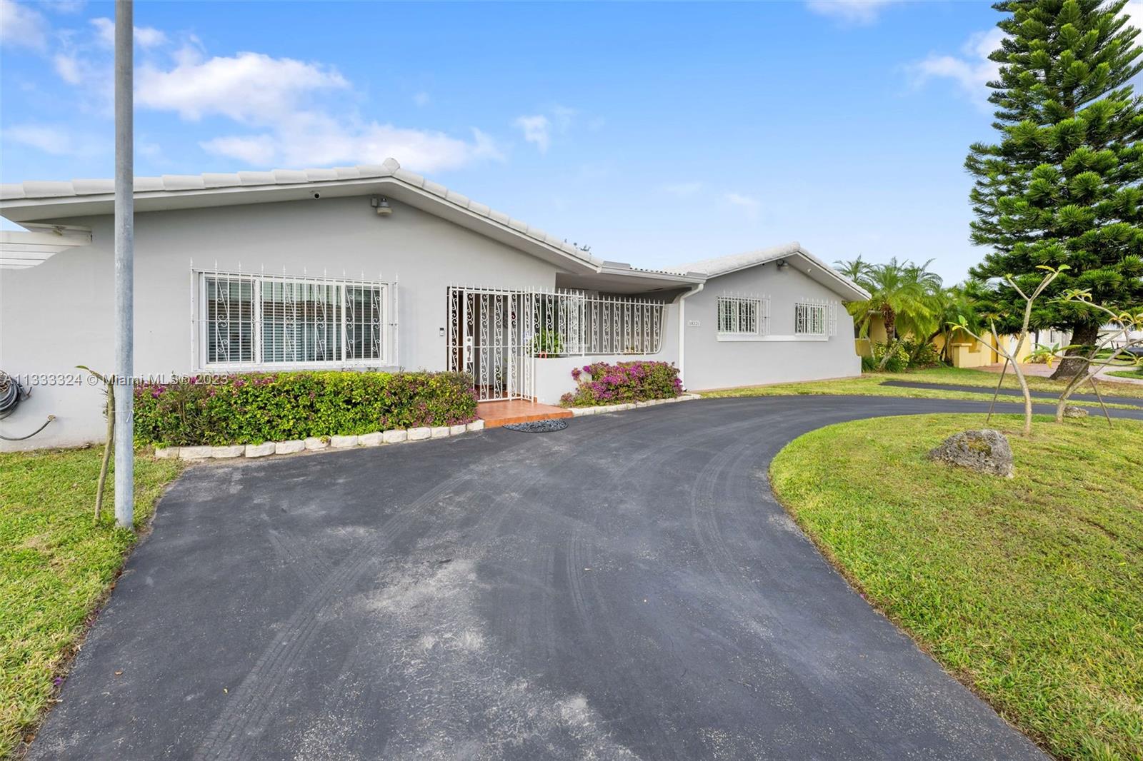 Looking for a spacious centrally located home within walking distance to the FIU Campus? Look no further than this beautiful and immaculately kept University Park home. Long time owners have lovingly maintained and upgraded this home over the years including electric storm shutters at rear sliding glass doors, impact windows and plantation shutters throughout. Enjoy the spacious living area with an eat-in kitchen connected to the family room, formal dining room overlooking pool area and formal living room. Oversized pool is perfect for a family get-together offering plenty of shady spacious to relax including a separate gazebo! Separate master suite on one side of the house perfect for an in-laws quarter, office or gym. This is a must see!