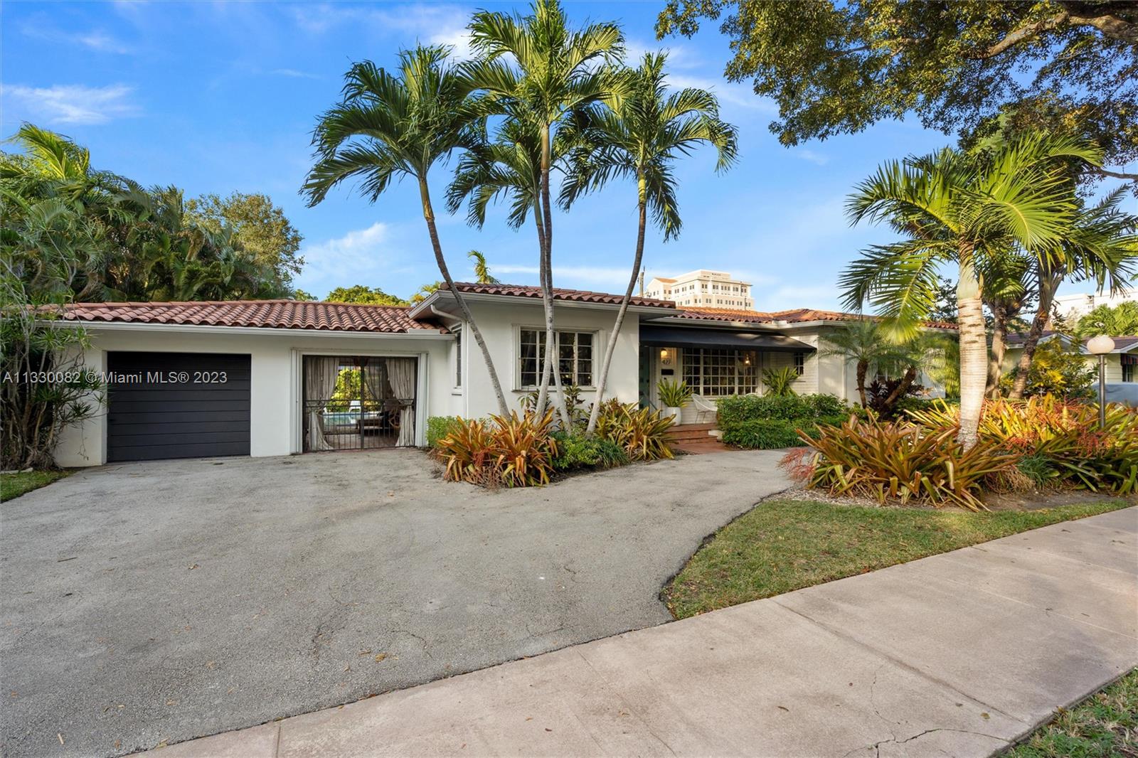 Resting on a 10,000 SQ FT double lot in a quiet area in Coral Gables, this 3-bed, 3.5-bath home is a recently-renovated expression of art deco chic. The open-format living, dining, and family room flow as one united space with terrazzo and wood floors, lined at the rear with geometric windows boasting views of the exquisitely-landscaped back yard and saltwater pool. Many features are brand new, including the roof, plumbing, HVAC system, washer/dryer, dishwasher, guest and master bathrooms, electrical (including SONOS), and landscaping. The breezeway was recently converted into an outdoor lounge, and the garage space can be converted into a guest suite, playroom, home office or gym. This one-of-a-kind property is conveniently located close to Miracle Mile, Youth Center, and Venetian Pool.