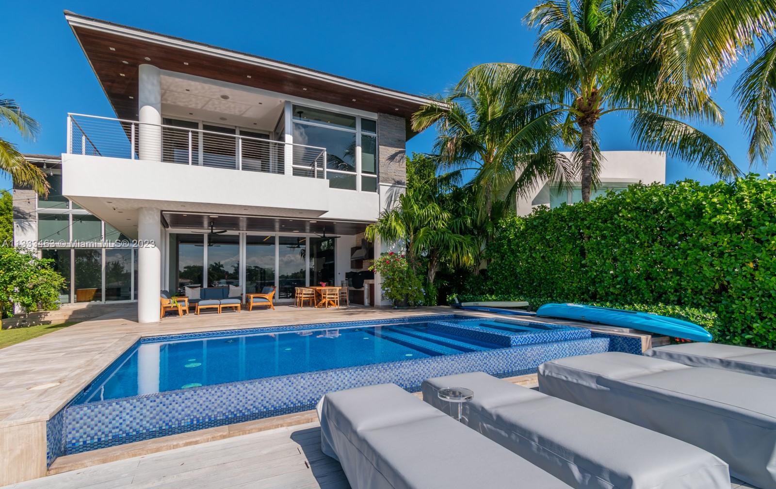 This stunning, modern villa with 7,451 SF of construction and 5,600 SF under A/C is Biscayne Point's most desirable listing. The south-facing, 11,250 SF lot offers a sun-exposed pool all day, 75 FT of waterfront, direct bay views, and ocean access. Built in 2015, but recently updated in 2022, it's a fully integrated smart home powered by Savant. Italian kitchen with Sub-Zero / WOLF appliances. Service quarters with bedroom / bathroom. Outdoor balconies on each bedroom, oversized terrace, infinity pool, manicured lawns and full outdoor summer kitchen - perfect for entertainment. Five minutes from Bal Harbour Shops and 10 minutes from the heart of South Beach. Pls call Juan