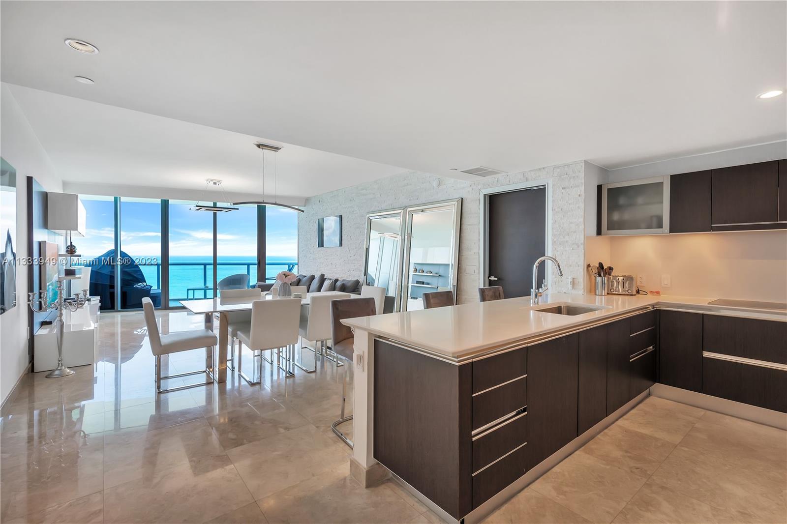 Distinguished ocean front living with state of the art amenities, infinity sunrise pool plus sunset enjoyment pool, Beach Club, complete fitness center, spa, concierge. Unit comes fully furnished with private entrance from elevator, several upgrades: electric shades, brand new top of the line washer and dryer, new A/C unit Bosch 4.5 tons, just painted. Furniture included sold as is.