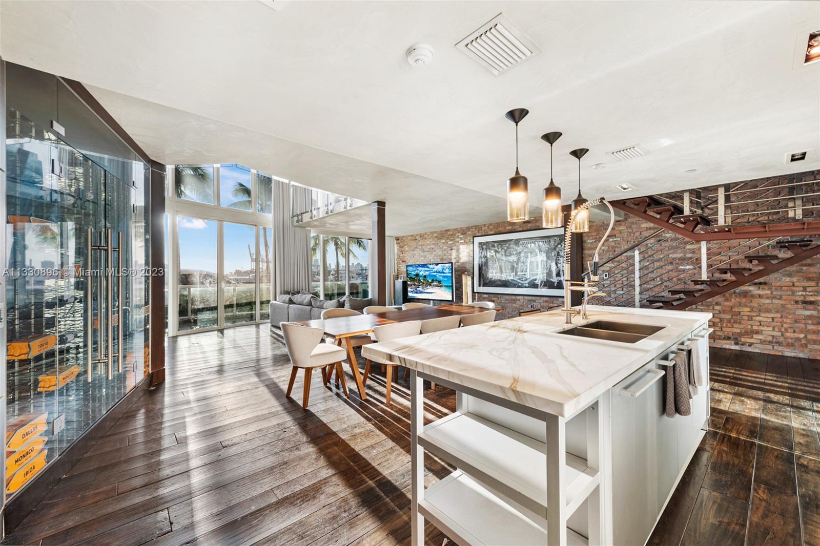 Welcome to the corner unit, waterfront townhome in Miami Beach. Located in the prestigious South of Fifth, this unit offers a highly desirable Miami lifestyle. Enter the floor-to-ceiling-windows living space with dramatic high ceilings right off the boardwalk and bay front . With an open floor plan, full of natural light, panoramic bay and skyline views are seen from all main areas of this townhome. Private yet accessible for entertainment, the fully turfed deck offers a glamorous outdoor entertainment space w/ private access to the community pool, gym, beach club and tennis court.