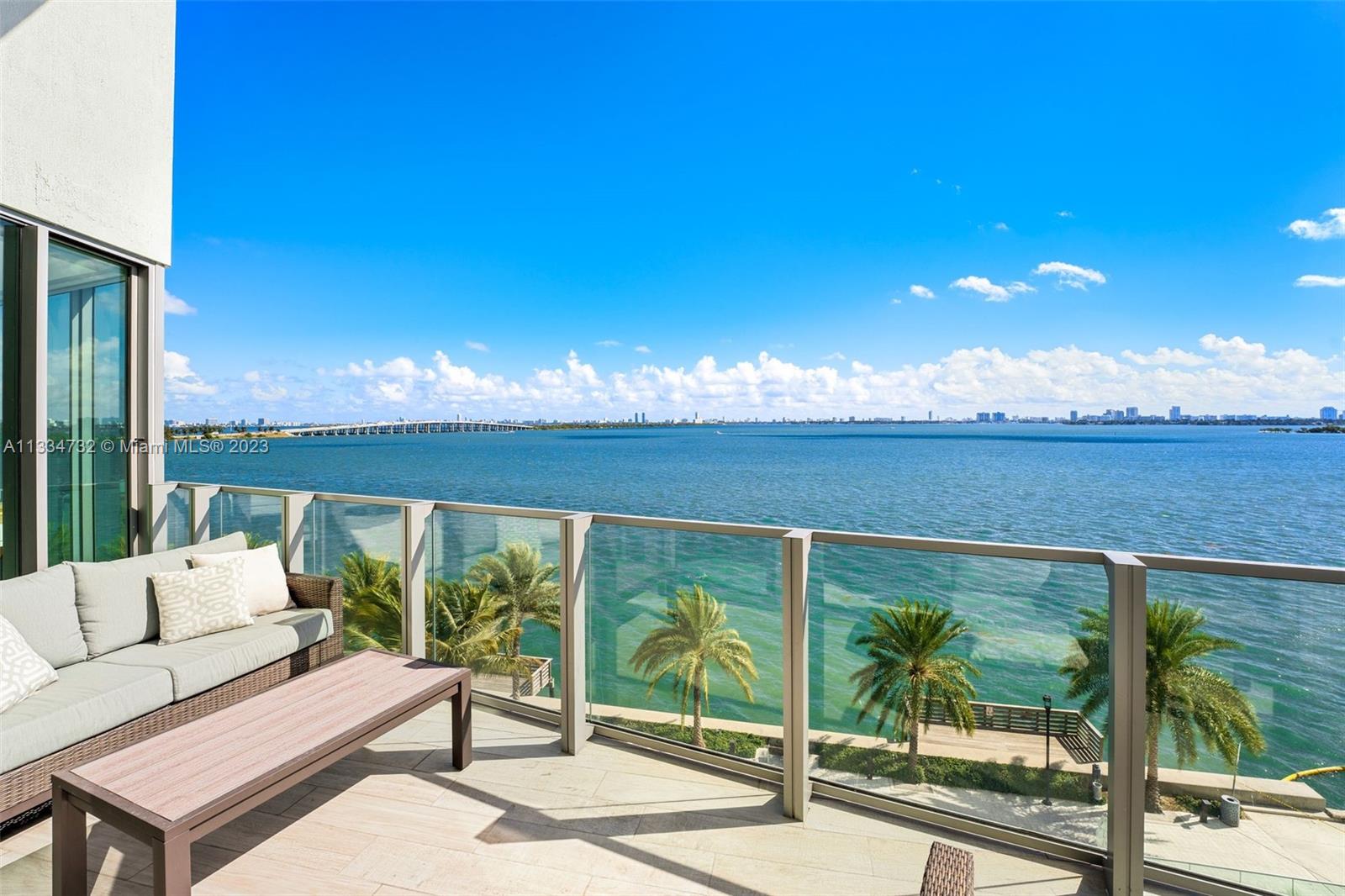 Enjoy unobstructed bay & Miami Beach views in this stunning residence in coveted Biscayne Beach. Enter this 4,146 SF residence through a private foyer that opens to breathtaking Biscayne Bay views w/80 linear ft. of living space facing directly east to the bay, floor-to-ceiling windows, 5 bedrooms, 5 full bathrooms & 1 half bath. Luxurious features incl captivating porcelain flrs, gourmet chef's kitchen with top-of-the-line appliances & 2 balconies overlooking the water. Oversized master w/sitting area & spacious closets in all bedrooms. Resort-style amenities that incl beach club w/cabanas, summer kitchen, 2 pools, jacuzzi, restaurant, lounge rm, theatre, business center, fitness center. Two reserved (side by side) parking spots –steps from your private vestibule on the same level.