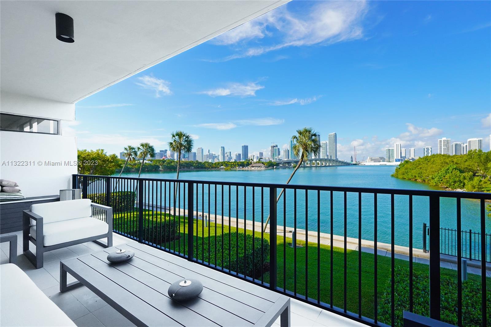 Breathtaking sunsets & unobstructed bay & city views. This one of a kind combined tri-level TH offers over 6,000SF living. Impeccably remodeled encompassing single family & condo living. Impressive design includes 4 beds, 4.2 baths, library, spacious primary bedroom, formal living showcasing floor to ceiling windows w/an abundance of natural light. Luxuries include an open gourmet kitchen, Savant smart system, glass staircase, private elevator, custom built-ins, informal living, office, walk-in closets, laundry room, 2 balconies, 2 car garage + 2 add'l spaces. The grand lawn allows for optimal indoor-outdoor living, ideal for entertaining. Full-service luxury building offering 24hr security, 2 pools, spa, gym, clubhouse, tennis courts, children’s playground, basketball court & a dog park.