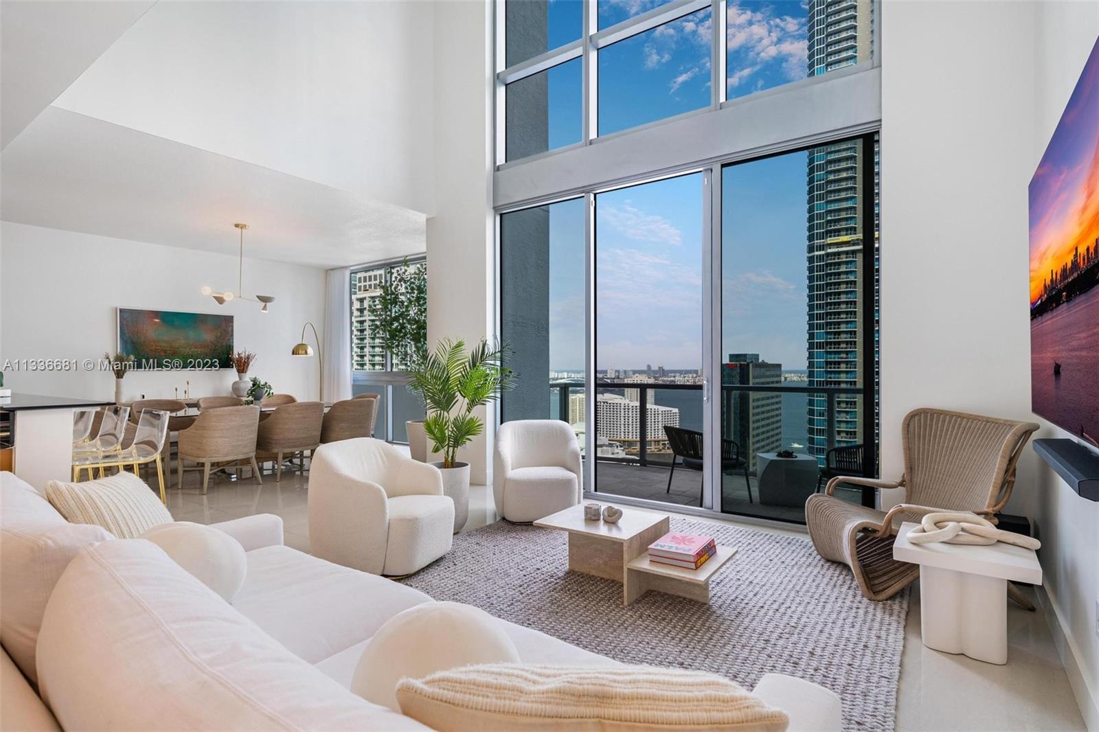 UNIQUE 2 story penthouse unit, right in the heart of Miami's Financial District, with spectacular views of Biscayne Bay, Brickell Skyline, and port of Miami. FULLY furnished "TURN KEY", with brand new high-end furnishings. Top of the line (Wolf, Miele) appliances, has built in Espresso coffee maker, and a wine cooler. Has two master Suites with King sized beds. The third bedroom has twin beds and additional rollaway bed and private bathroom. Tv's in every room as-well in living and dining room. Office with gorgeous views through the double high windows. Powder room/laundry room with sink and extra storage space. Walking distance from fine dining, shopping, and BBC. Amenities include fitness center, steam room, swimming pool, Jacuzzi, Golf Simulator, wine and cigar room, and party room.