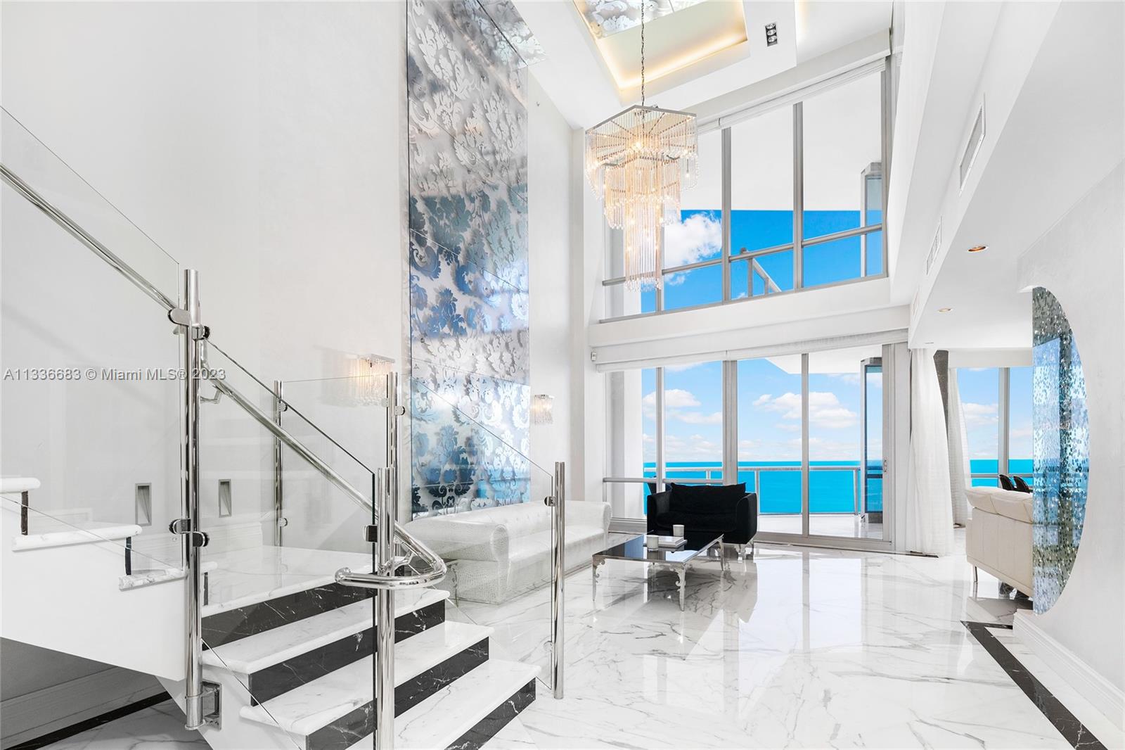 This fabulous 2-story Lower PH in Sunny Isles at the Jade Ocean was designed by World renowned architect Carlos Ott. Private foyer off elevator with double entrance doors, this 4BR/4+1BA unit boasts soaring 20FT plus ceilings & spans over 4,303 SF of interior spaces & numerous terraces that overlook the ocean with magnificent sunrises and breathtaking sunsets. Exquisite 36”x36” Calcutta Gold select marble floors throughout w/Black Marquina marble borders & accents. Sleek chef’s kitchen sports top-of-the-line Subzero & Miele appliances, center island. Beautiful oceanside principal suite & bath. Creston system, electric blinds/blackouts, hurricane impact doors/windows & separate laundry room. Jade Ocean is a full-service building, including concierge, valet parking & more.