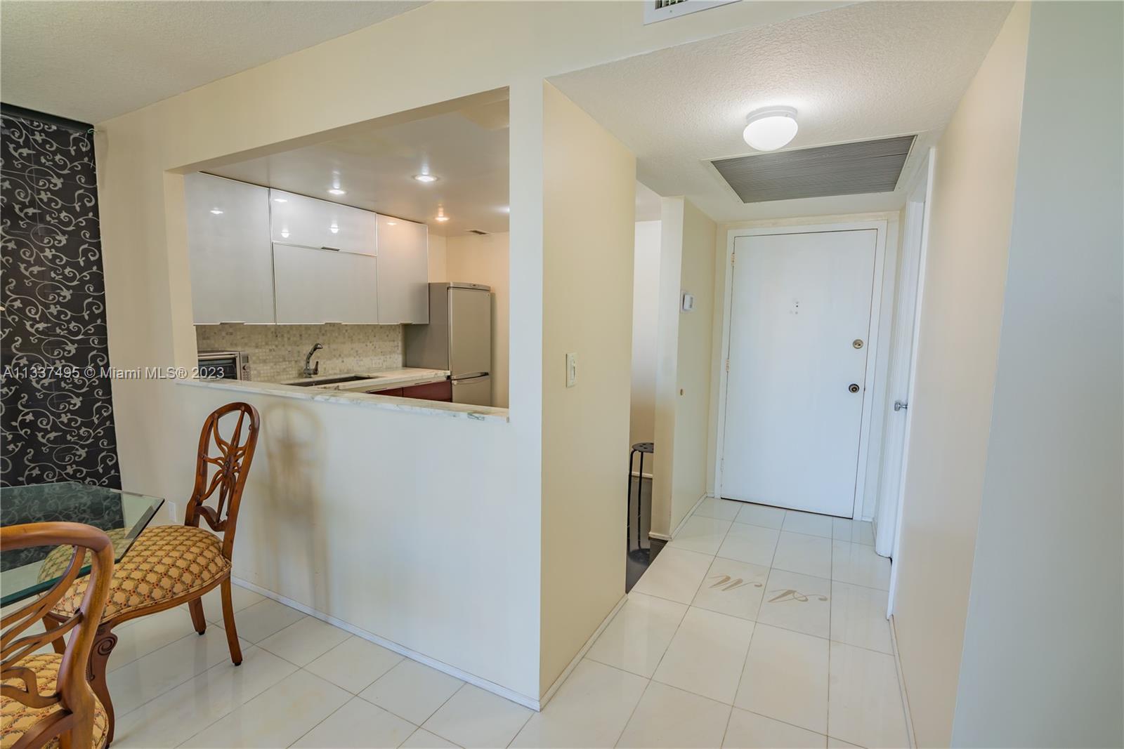 VIEW TOWARDS KITCHEN AND ENTRANCE