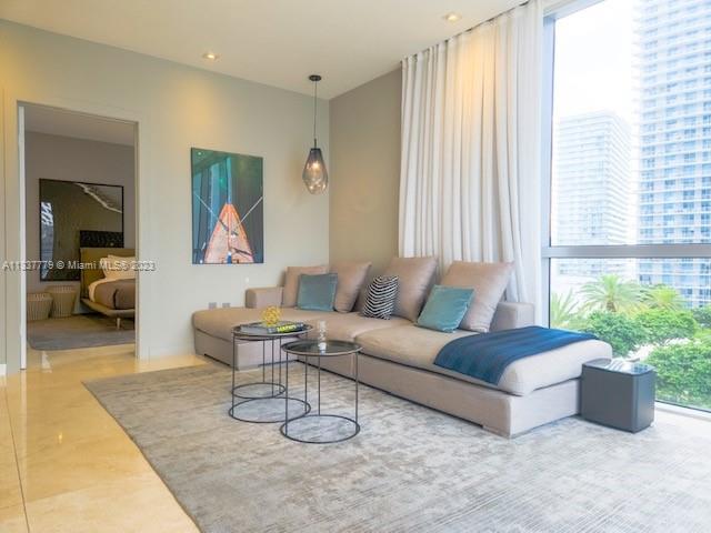 GORGEOUS PROFESSIONALLY DECORATED AND RENOVATED CORNER UNIT-- 2 BEDROOMS, 2.5 BATHS-- With garden and Brickell Avenue  view  furnished with curated Italian and Scandinavian furniture. The Living room design and custom woodwork maximizes the space accommodating a Dining table for 6, a 3 seat sofa with a chaise & a 65' TV with Bose sound system. The unit upgrades include new lighting design, updated kitchen, large mirrors and new appliances- Dishwasher, dryer, new ac and water heater. Building amenities: Renovated spacious fitness center, steam room , swimming pool, golf simulator, billiard room & party room. Centrally located in the heart of Brickell &  walking distance to many restaurants supermarkets and shopping mall. Easy to show.