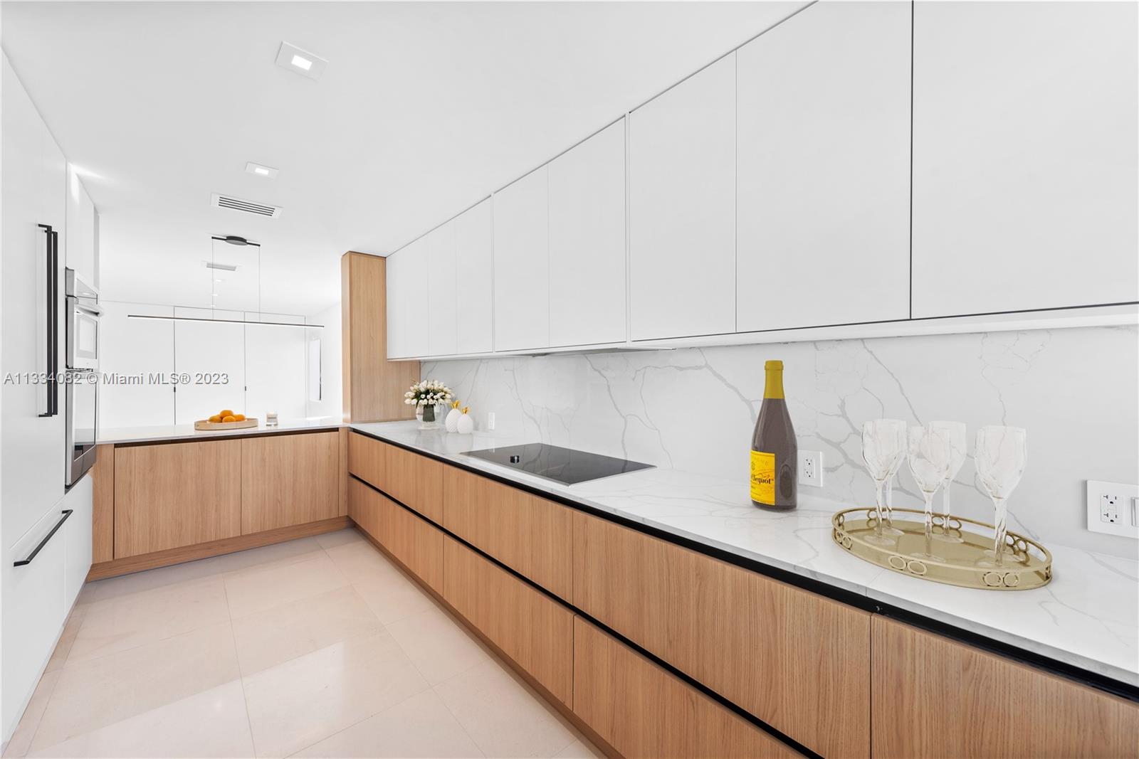 Beautiful wood accents, and marble backsplash!