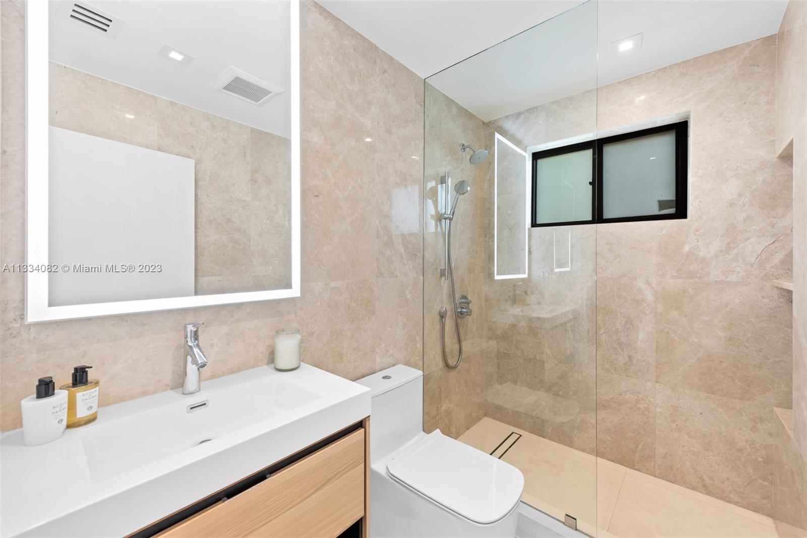 Bathrooms with lighted mirrors & steam showers!