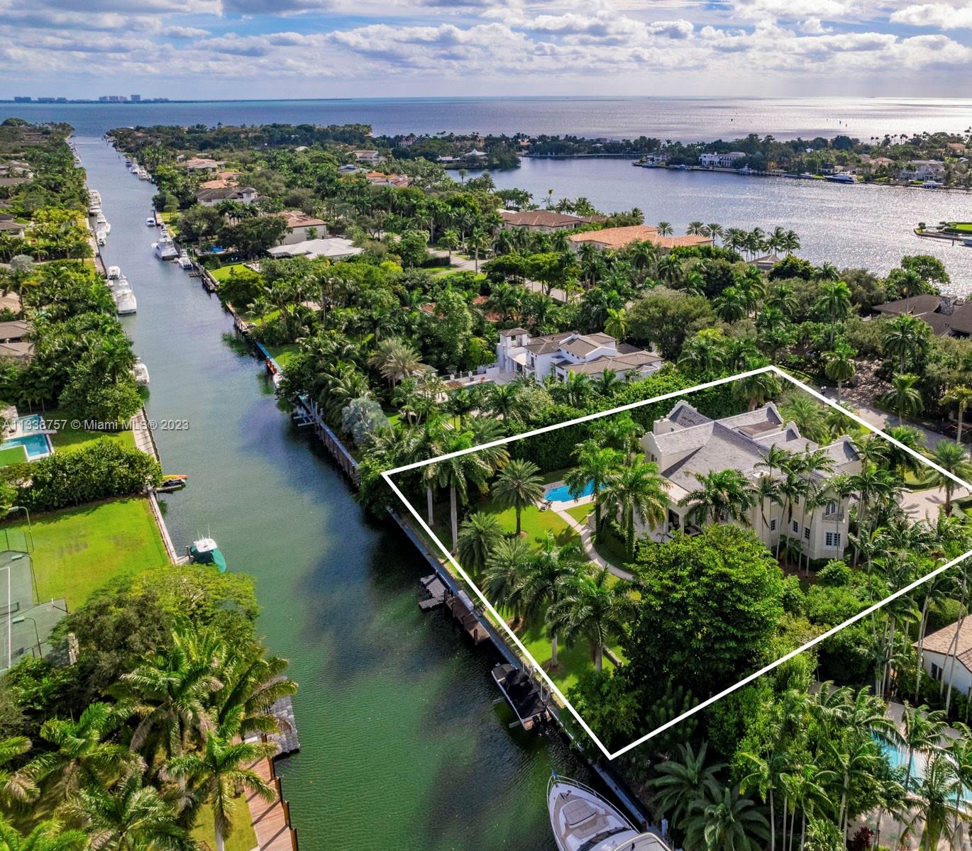 585 Arvida Parkway is a spectacular 12,102 Sq.Ft. waterfront residence on beautifully landscaped grounds in the prestigious community of Gables Estates. Featuring east and west wings, the exterior facade melds Dutch and Island influences. The elegant interiors include double height ceilings, stunning living and formal dining rooms, and chef's kitchen with Gaggenau appliances and breakfast area. The main suite has a luxurious marble bath with a long-mirrored vanity, jacuzzi and multi-jet shower, and two walk-in closets. Other special features include an elevator, family room, library, two fireplaces and 4-car garage. The resort-style outdoors have covered terraces, a pool and 180 feet of waterfront, with direct access and no bridges to Biscayne Bay.