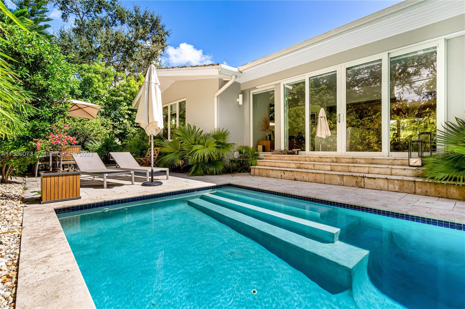 Modern tropical oasis in the heart of Coconut Grove! This stunning mid century modern home features 4 bedrooms, 3 baths, gourmet chef's kitchen. Sprawling 3000 sq ft open floor plan, incredible natural light, all impact windows and doors, sparkling pool, patio, bbq, lush gardens and 2 car garage. Located in prestigious Bay Heights a walled community with 24 hour patrol, minutes to Downtown Brickell, steps to all the best marinas, miles of waterfront parks, world class shopping and dining, great entertainment, the best schools in the city. This is the ultimate Miami lifestyle.