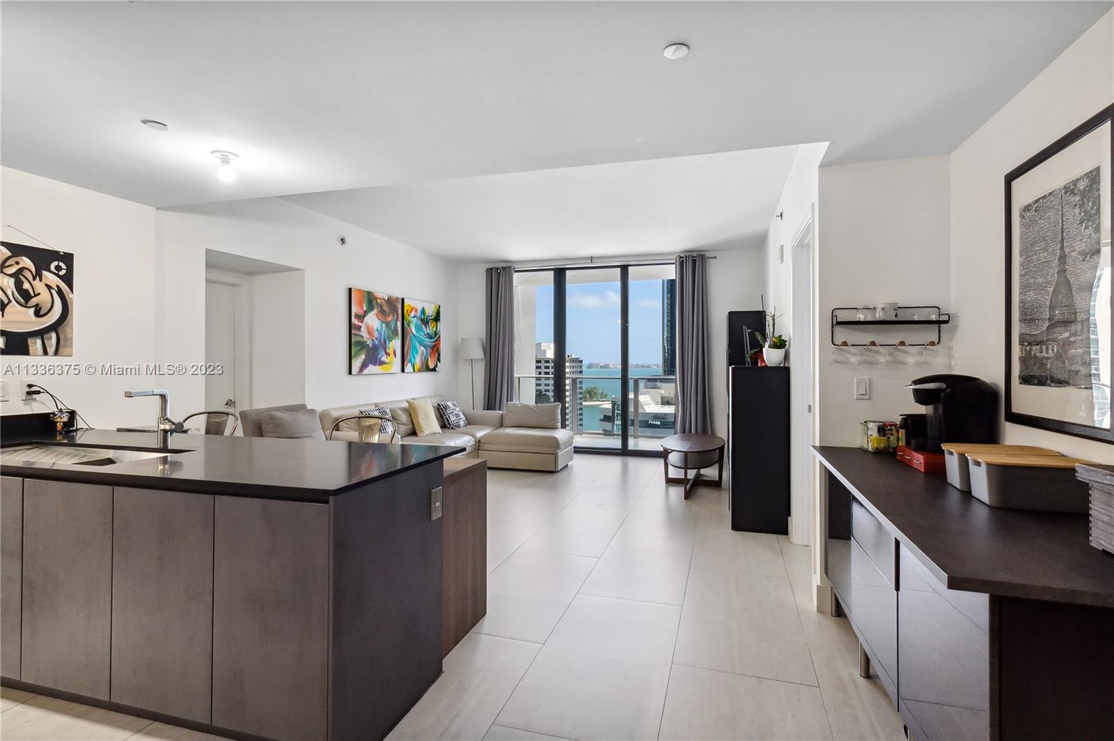 This unit has some great features that sets it apart from other 2 bedroom units: Private Elevator, wood kitchen counter, closets on 2nd bedroom among others. The den is closed with a sliding door and can used as a 3rd bedroom (closets were added).
1010 BRICKELL is known for its superb amenities like indoor heated pool, rooftop pool and BBQ, running track, PICKLE BALL, half basketball court and more!

Enjoy living waking distance to Brickell City Center, Restaurants, work and be on the center of it all!

Eady to show!