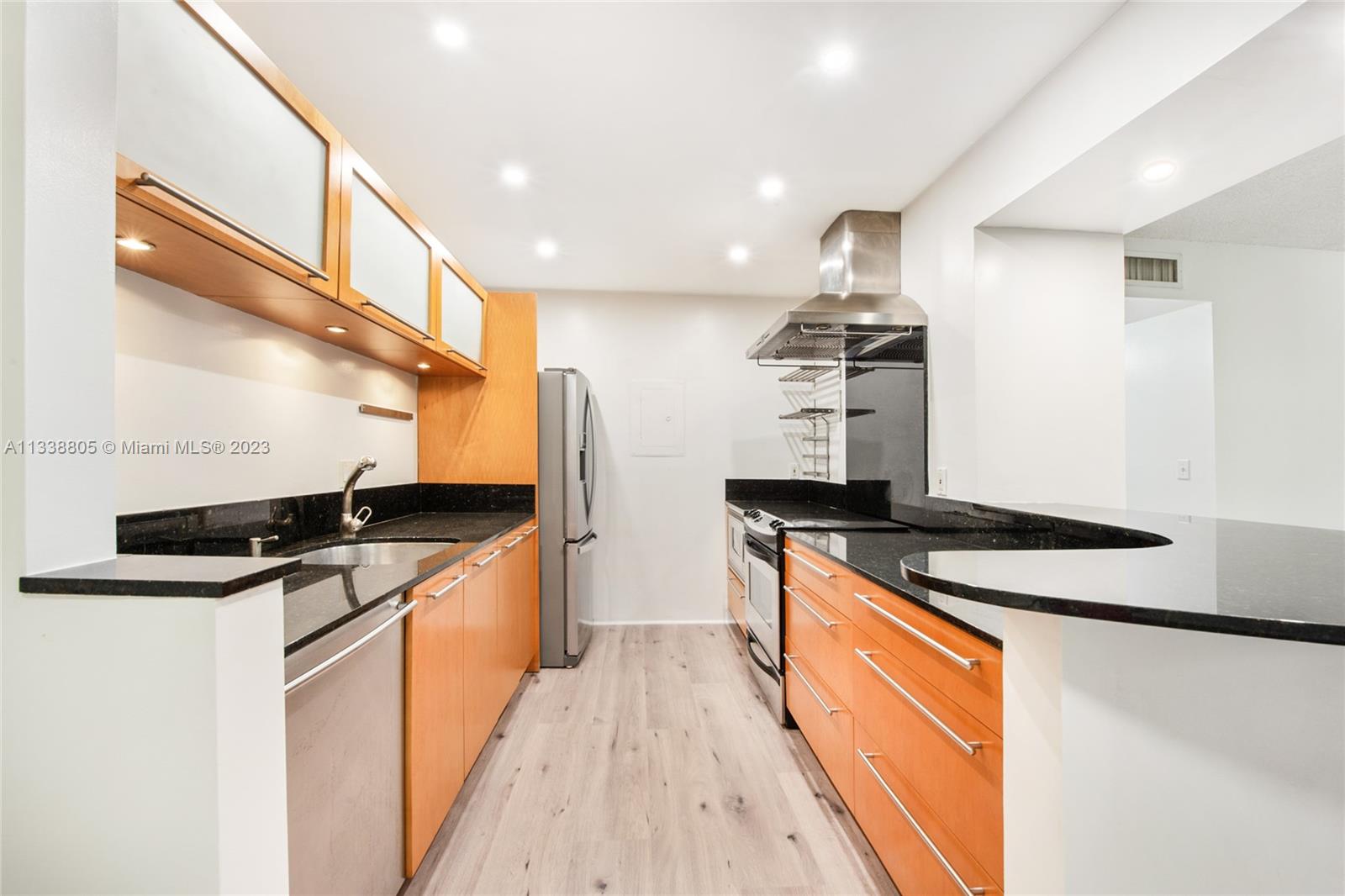 Want 2 bedrooms 2 baths in Dadeland area without paying too much?  How about washer & dryer in the unit?  And lots of parking too?  Look no further than this impeccable unit in Kings Creek WEST.  Brand new floors, freshly painted and waiting for its next owner! Recessed lighting throughout. Condo maintenance fee includes cable, exterior insurance, Fumigation, Tennis, Community pool, and on-site management office. Unit also comes with STORAGE SPACE! Plenty of parking, located on 2nd floor for added privacy. Nice balcony overlooking garden and trees.  2 blocks from Palmetto, restaurants, shopping, everything!  This unit won't last, call listing agent today!