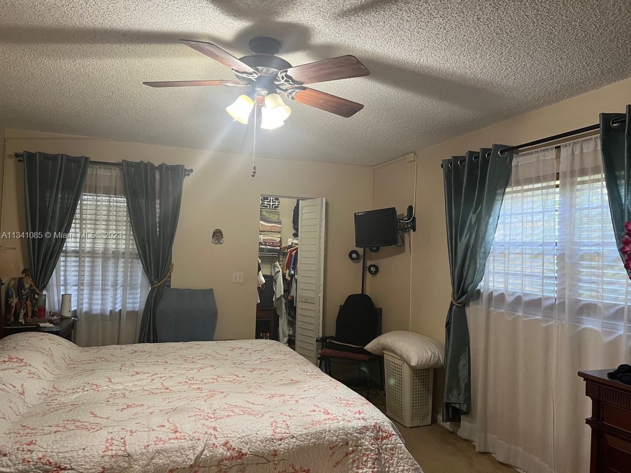 Master bedroom with walking closet & 2 windows