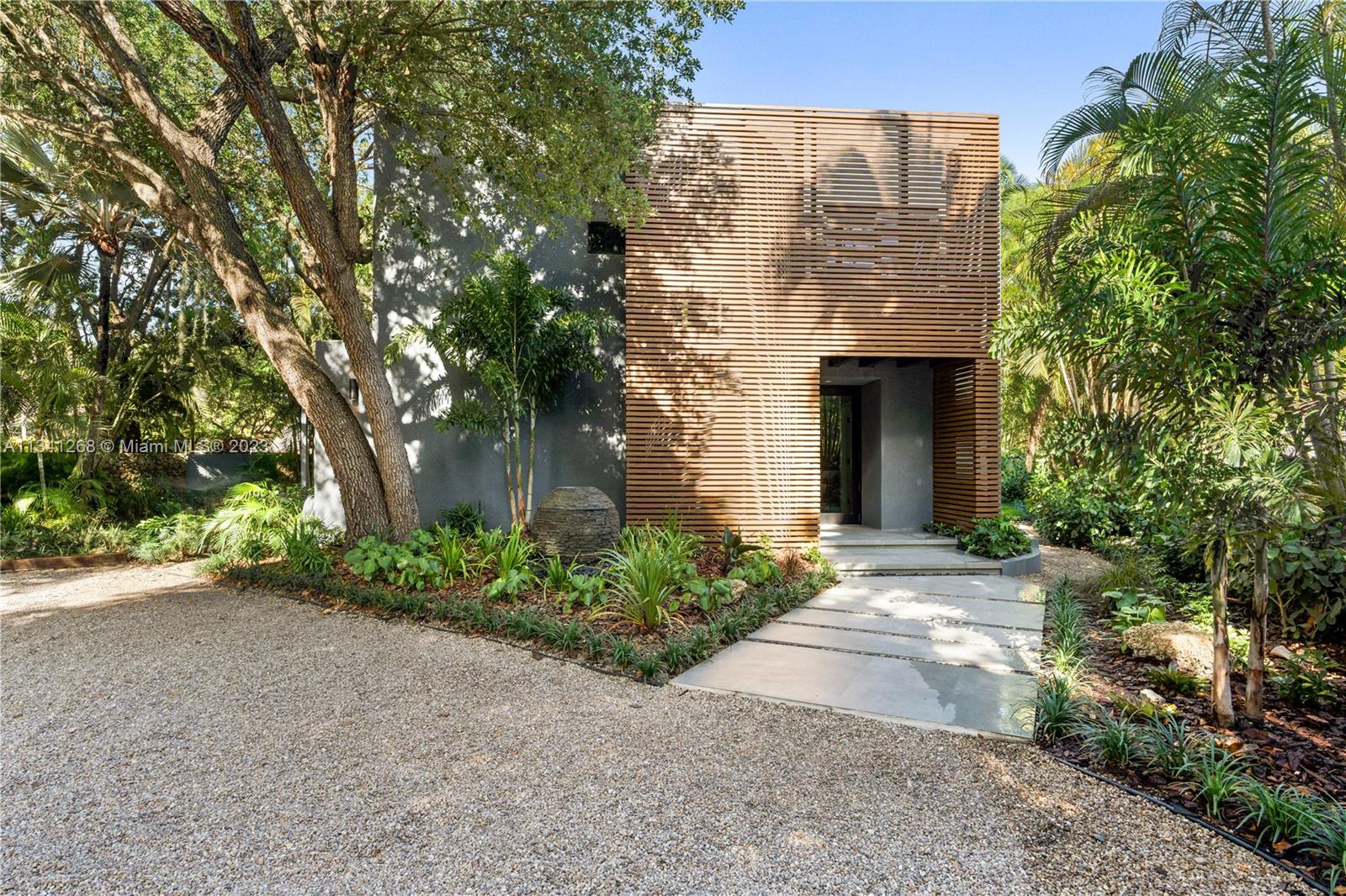 A stunning modern oasis in the heart of Pinecrest. Completely renovated house with 3 bedrooms and 2.5 baths. Ready for occupancy. Built for the most discerning homeowners, this house is equipped with only the finest: a 7-zone VRF a/c system (with individual temperature control), high-end Bosch appliances, fully landscaped with lush tropical vegetation and trees, and high-impact windows and doors throughout. Entertain your guests with extensive outdoor decks, a covered terrace area, and a 6-person spa while cooking in your kitchen with custom wood cabinets and quartz countertops, within walking distance of convenience stores, restaurants, and top schools in Pinecrest. It won't last long.