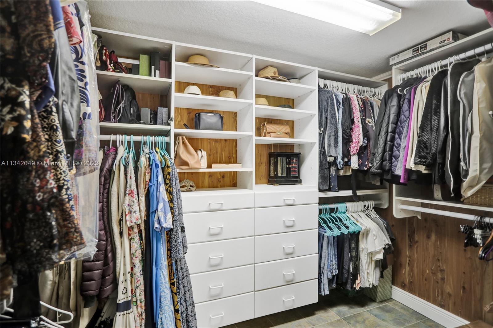 Primary Bedroom Walk-in closet with built-ins