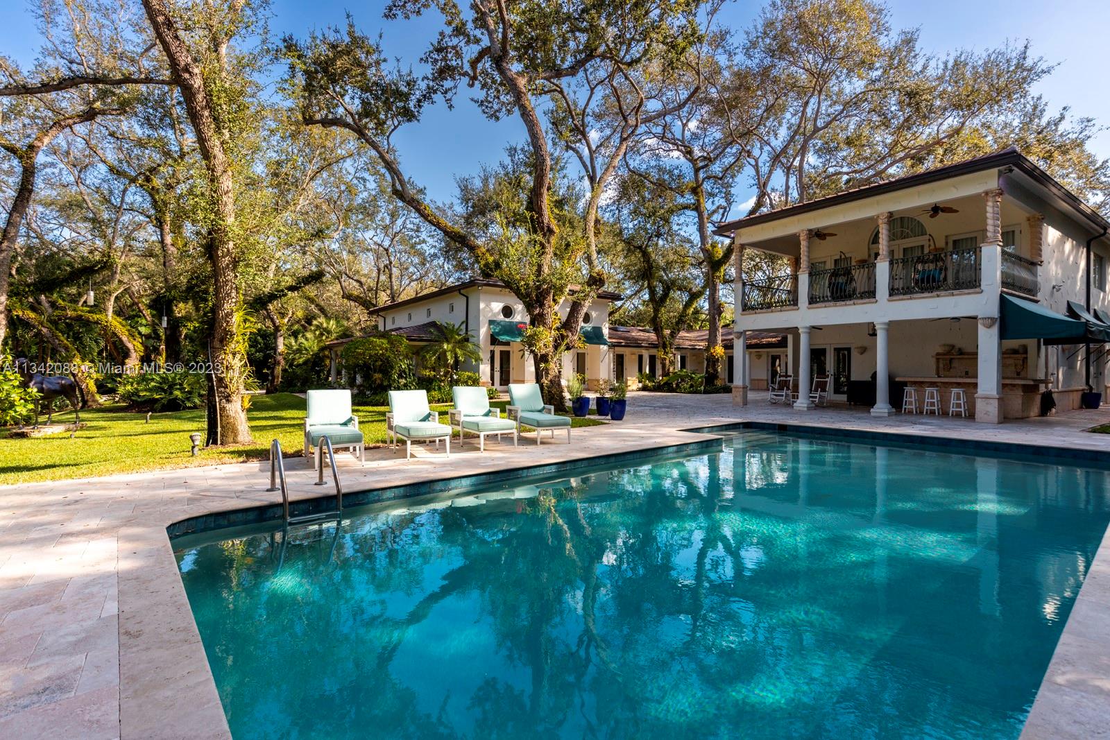 Welcome to this stunning 6 bedroom, 5 bathroom and 2 half-bathroom home located in the highly sought-after community of Snapper Creek Lakes. Boasting a spacious open floor plan with an abundance of natural light, this home features a large chef's kitchen with high-end stainless steel appliances and custom cabinetry, perfect for entertaining guests. The primary bedroom suite includes a walk-in closet and a luxurious spa-like bathroom. 

Situated on a 1.5 acre waterfront lot, there is ample room to enjoy your backyard oasis complete with a pool, covered patio, and lush landscaping. Enjoy living on a quiet street with easy access to restaurants, shopping, and parks. This is the perfect home for those seeking both luxury and convenience.