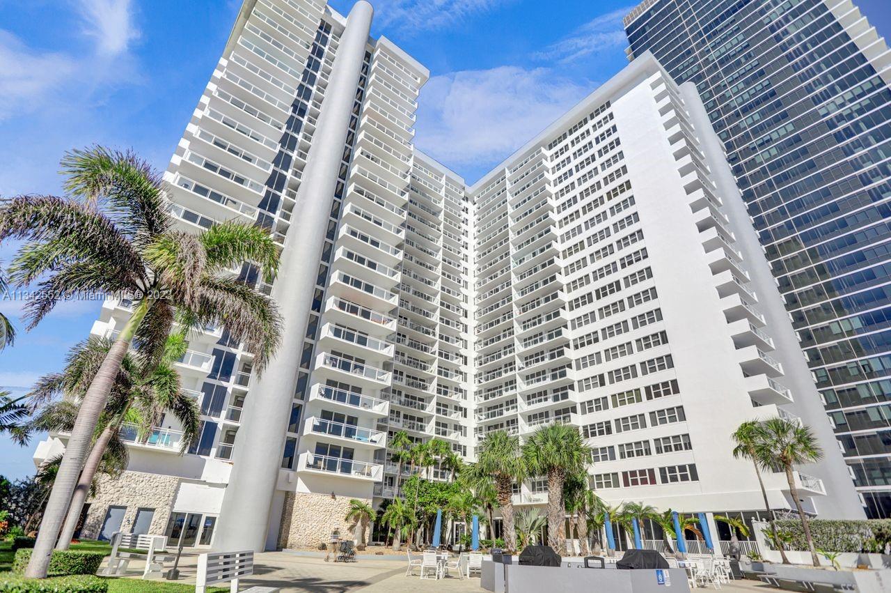 EXTERIOR FACADE FACING OCEAN WITH NEW GLASS TERRACES