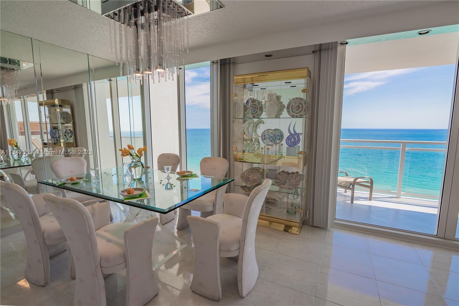 DINING ROOM LIVING ROOM WITH DIRECT OCEAN FLOOR-TO-CEILING OCEANFRONT LOCATION VIEWS