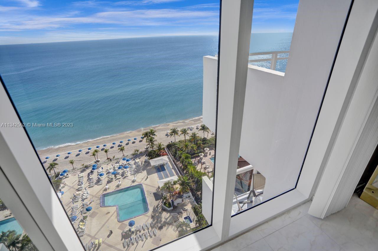 FLOOR-TO-CEILING HURRICANE IMPACT WINDOWS WITH DIRECT OCEAN VIEWS